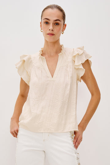Calista V-Neck Ruffle Sleeve Blouse with a Ruffled Neckline and Gathered Front Yoke in Ivory Colorway. Front View Shown on Model.