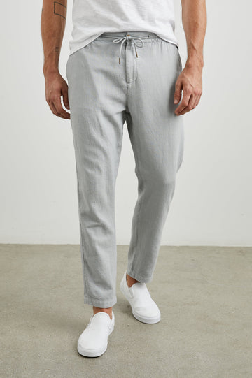 Callum Pants with a Drawstring Waist, Two Front Pockets and a Back Patch Pocket in Cement Colorway - Front View Featured on Model