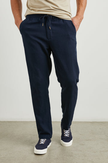 Callum Pants with a Drawstring Waist, Two Front Pockets and a Back Patch Pocket in Deep Meridian Colorway - Front View Featured on Model