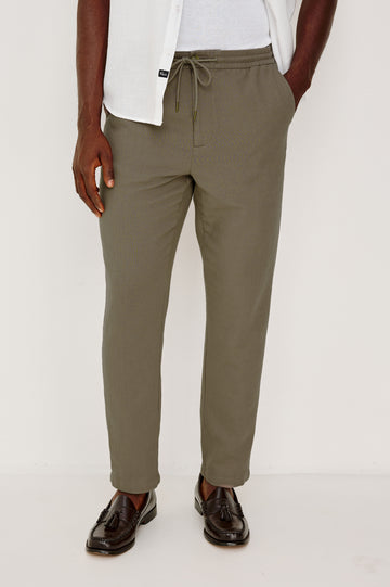 Callum Tapered Straight Leg Pant in Linen Twill With Adjustable Drawstring Waistband Ties in Fallen Rock Colorway - Lower Body Back View Featured on Model