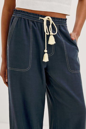 Campo Wide Leg Pant with Drawstring Waistband, Front Utility Patch Pockets and Contrast White Stitching in Navy Colorway. Front Detailed View Shown on Model.