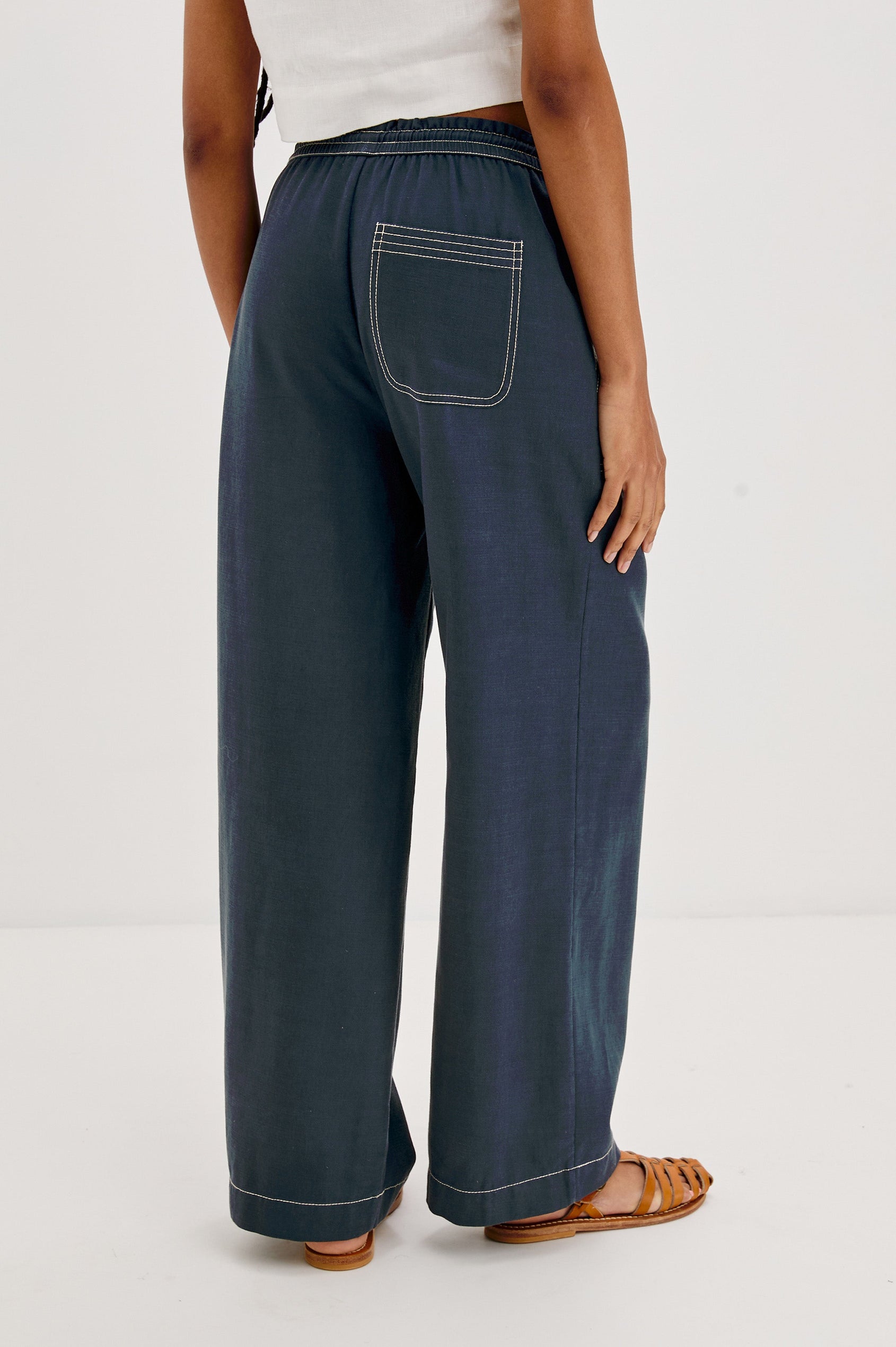 Campo Wide Leg Pant with Drawstring Waistband, Front Utility Patch Pockets and Contrast White Stitching in Navy Colorway. Back View Shown on Model.