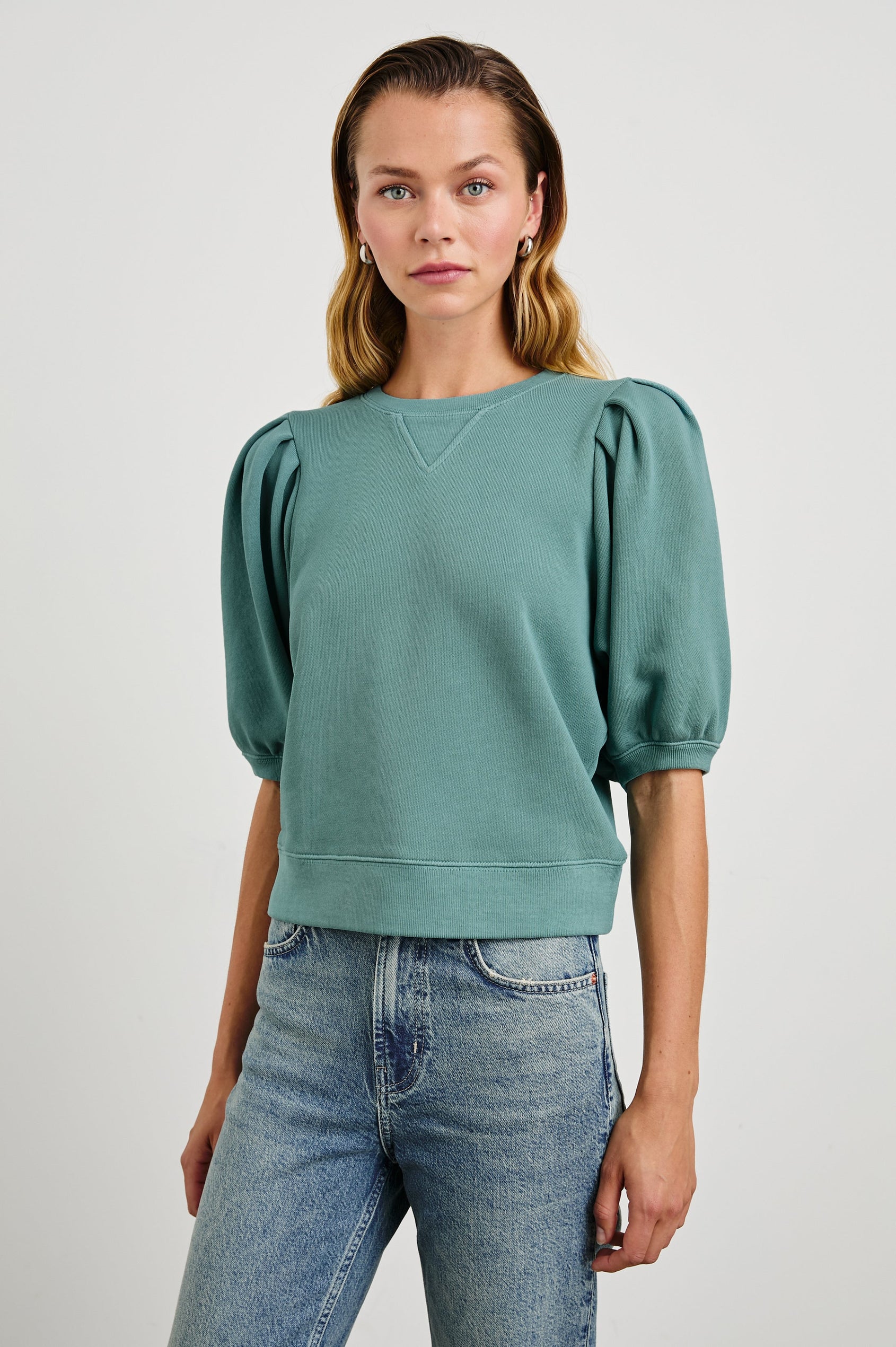 Camy Sweatshirt with Elbow Length Puff Sleeves and a Crew Neck in Stone Blue Colorway - Front View Featured on Model 