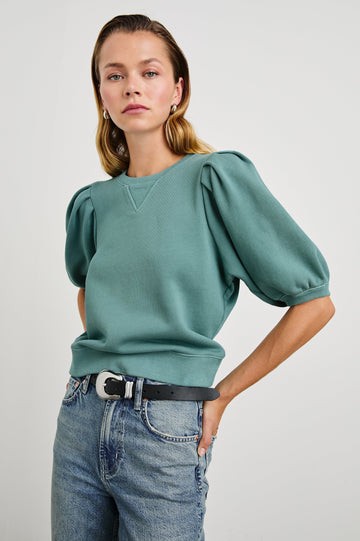 Camy Sweatshirt with Elbow Length Puff Sleeves and a Crew Neck in Stone Blue Colorway - Front View Featured on Model 