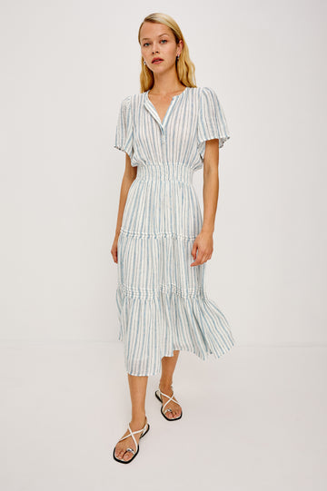 Cannes Midi in Linen With Half Placket Neckline Short Sleeves Smocked Waist and Tiered Skirt in Windward Stripe - Full Body Front View Featured on Model