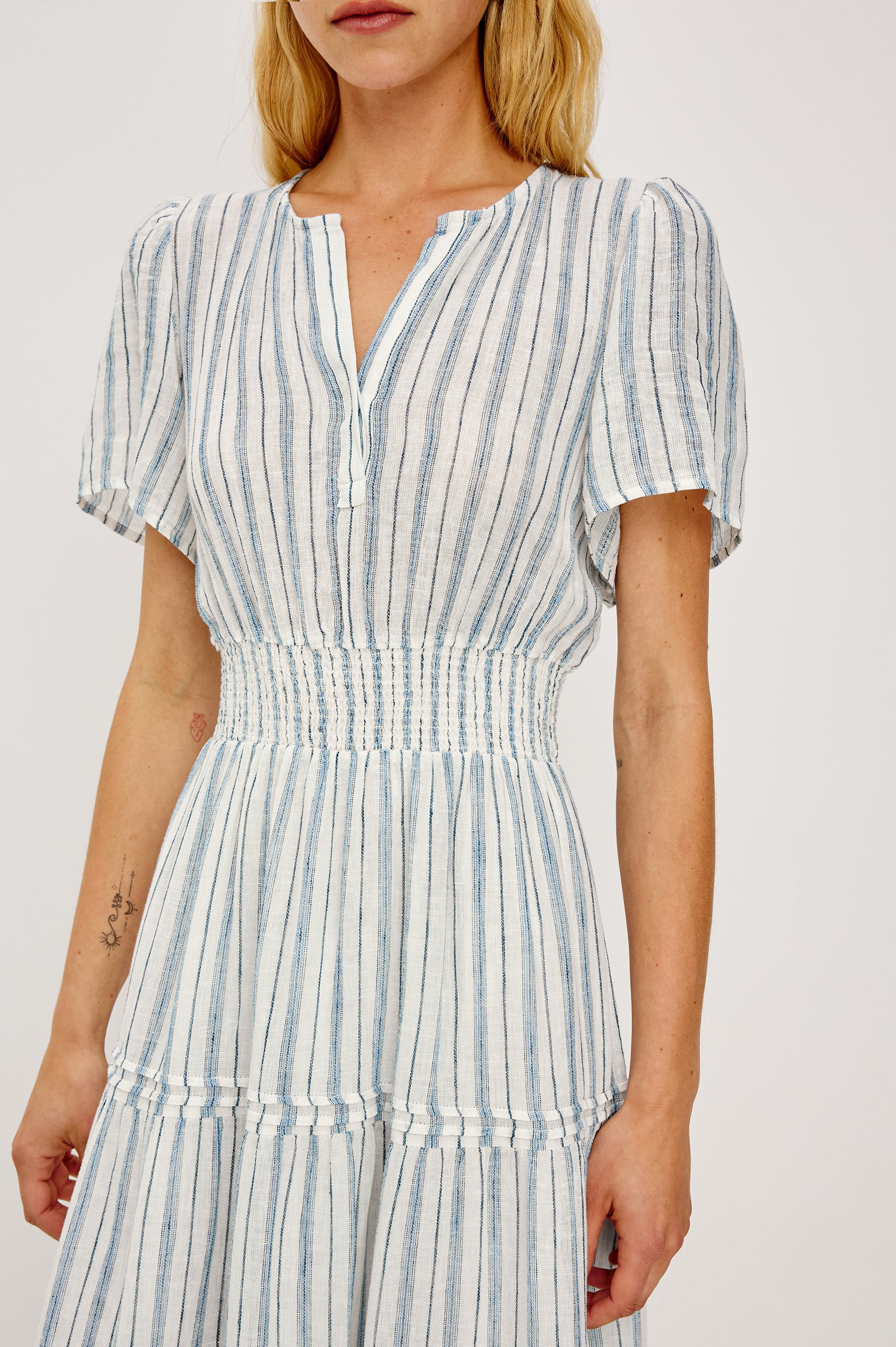 Cannes Midi in Linen With Half Placket Neckline Short Sleeves Smocked Waist and Tiered Skirt in Windward Stripe - Upper Body Front View Featured on Model