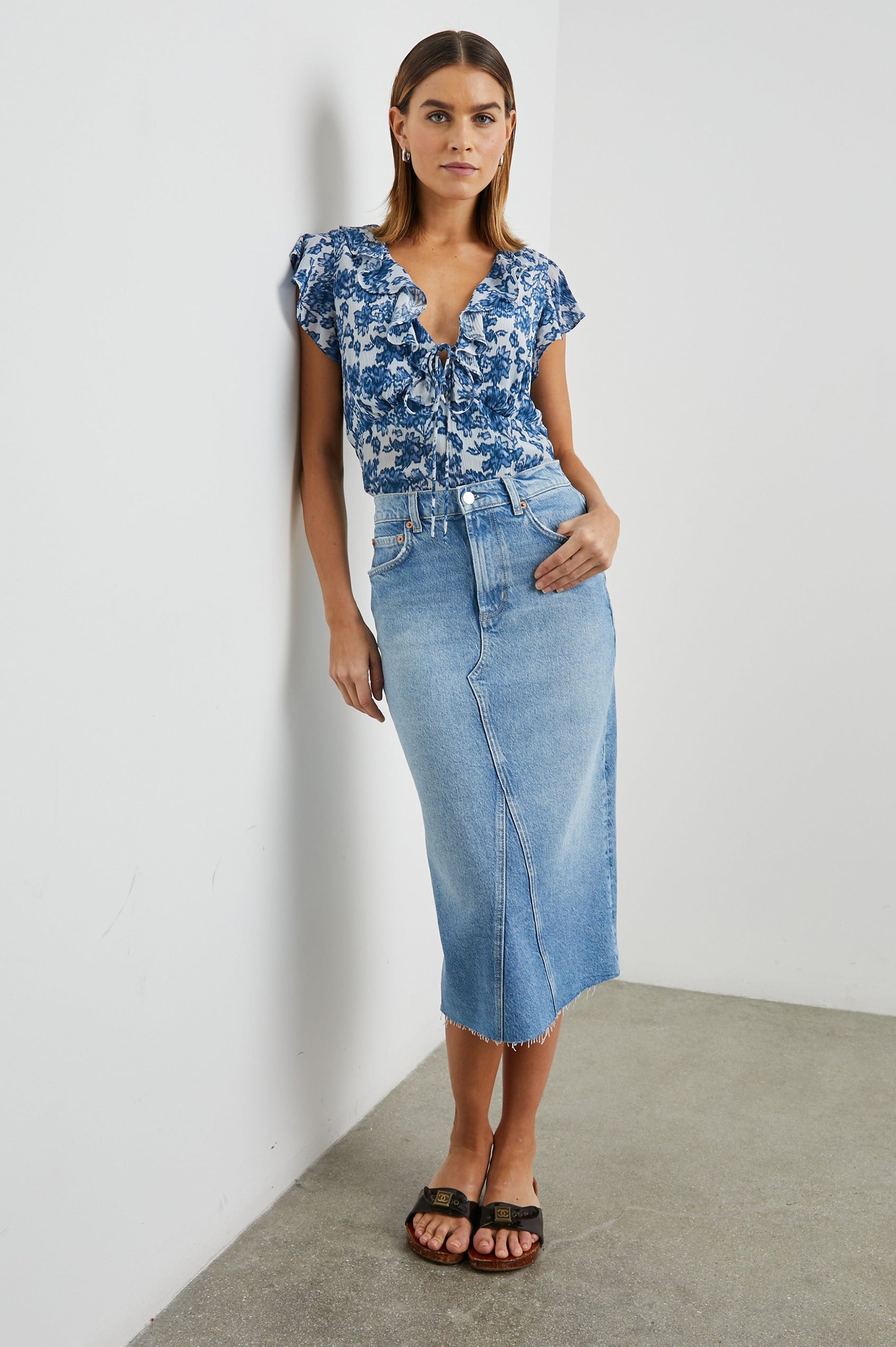 Carmine Top with Flutter Sleeves, Deep V Neck with a Tie, and a Ruffled Neckline in Chambray Floral Colorway, Chambray flowers on white - Front Full Body View Featured on Model