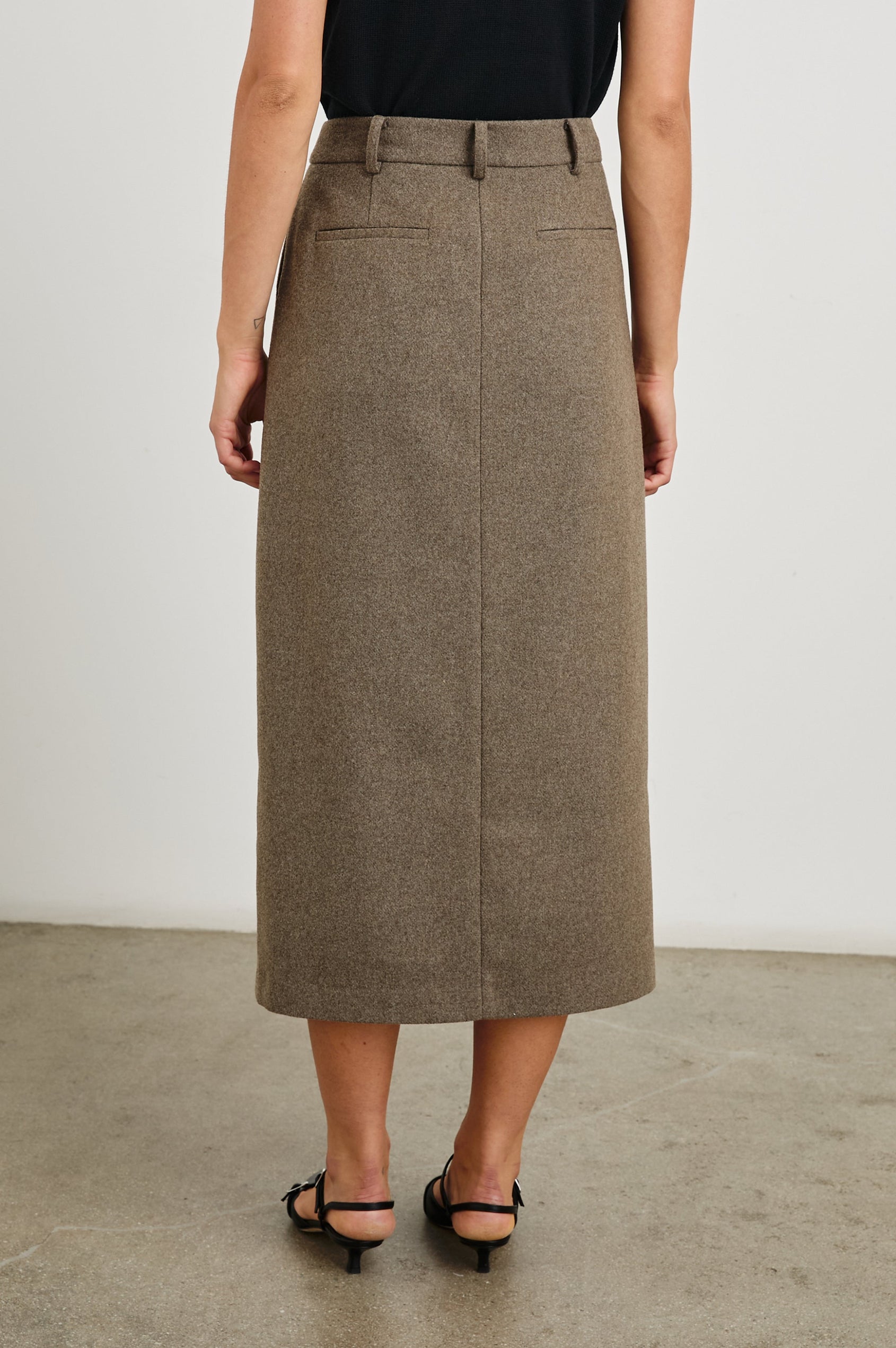 Carolina Midi Skirt with a Center Slit, Belt Loops, Two Front Pockets and Two Back Welt Pockets in Hazelnut Colorway - Back View Featured on Model 