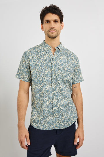 Carson Collared Button Front Shirt with Short Sleeves and a Chest Pocket in Ecru Banana Leaf Colorway. Front View Shown on Model.