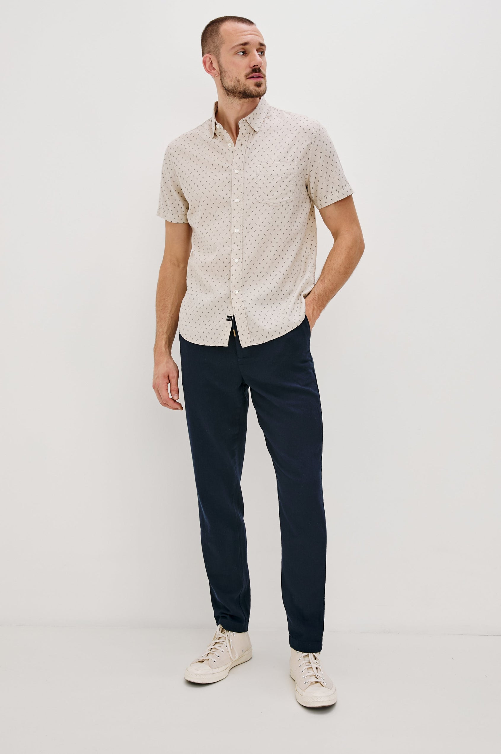 Carson linen short sleeve button down with a collar and front chest pocket in Petite Fronds Hummus colorway - full body front view on model