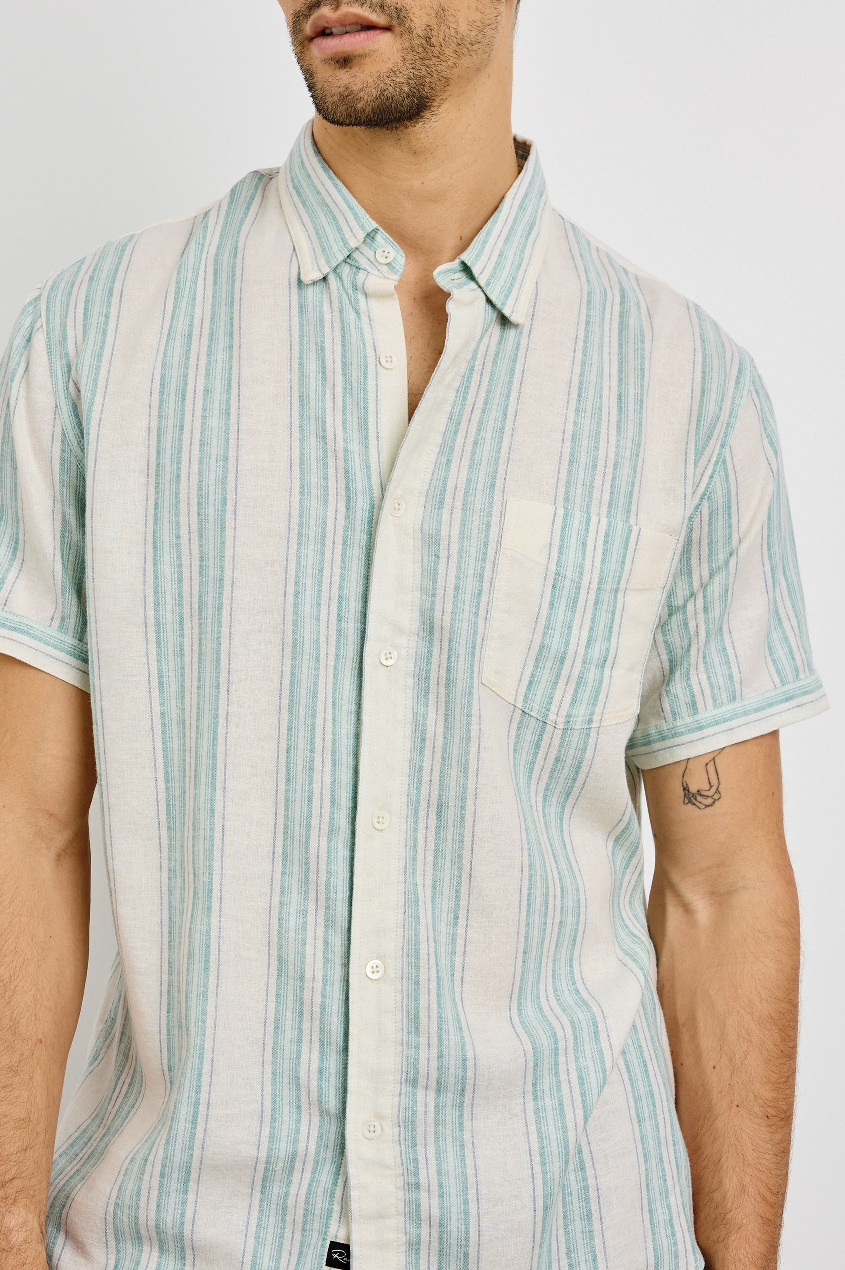 Carson Collared Button Front Shirt with Short Sleeves and a Chest Pocket in Riviera Stripe Colorway. Front View Shown on Model.