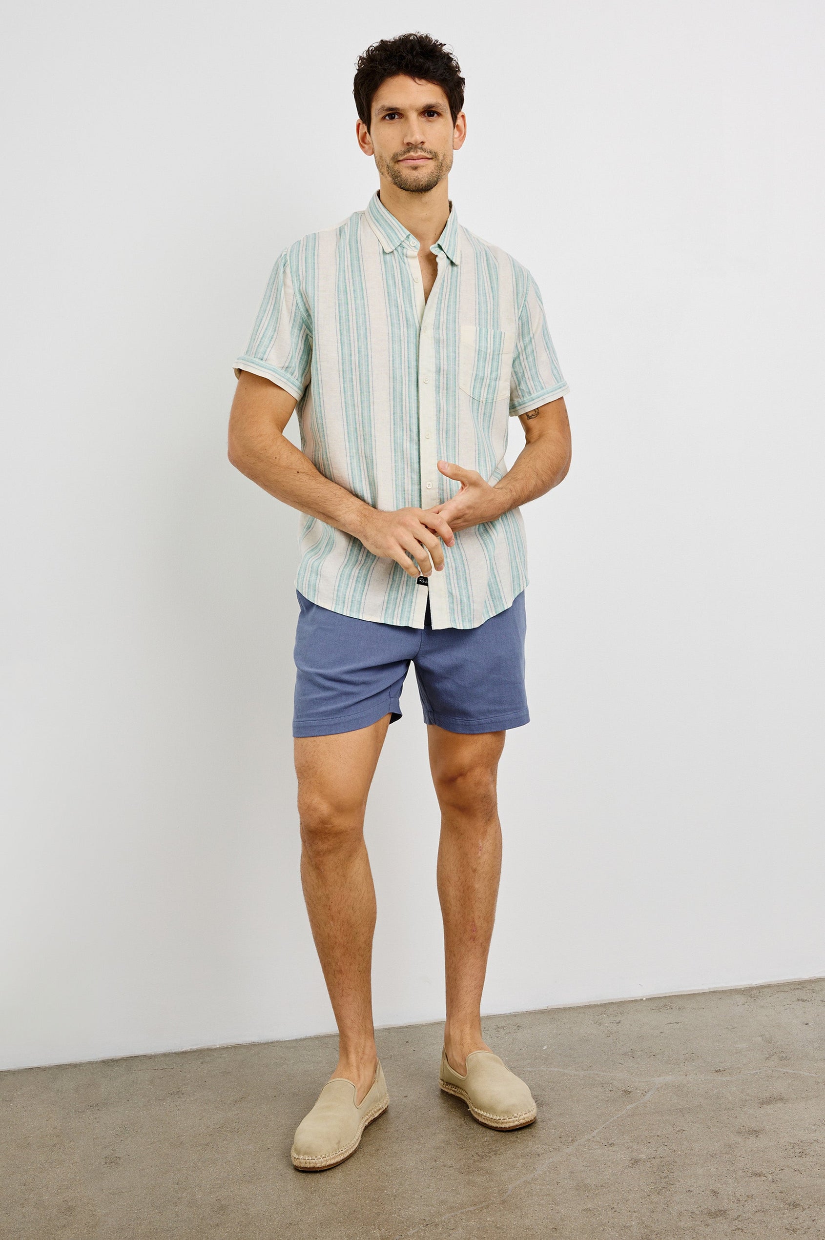 Carson Collared Button Front Shirt with Short Sleeves and a Chest Pocket in Riviera Stripe Colorway. Front View Shown on Model.