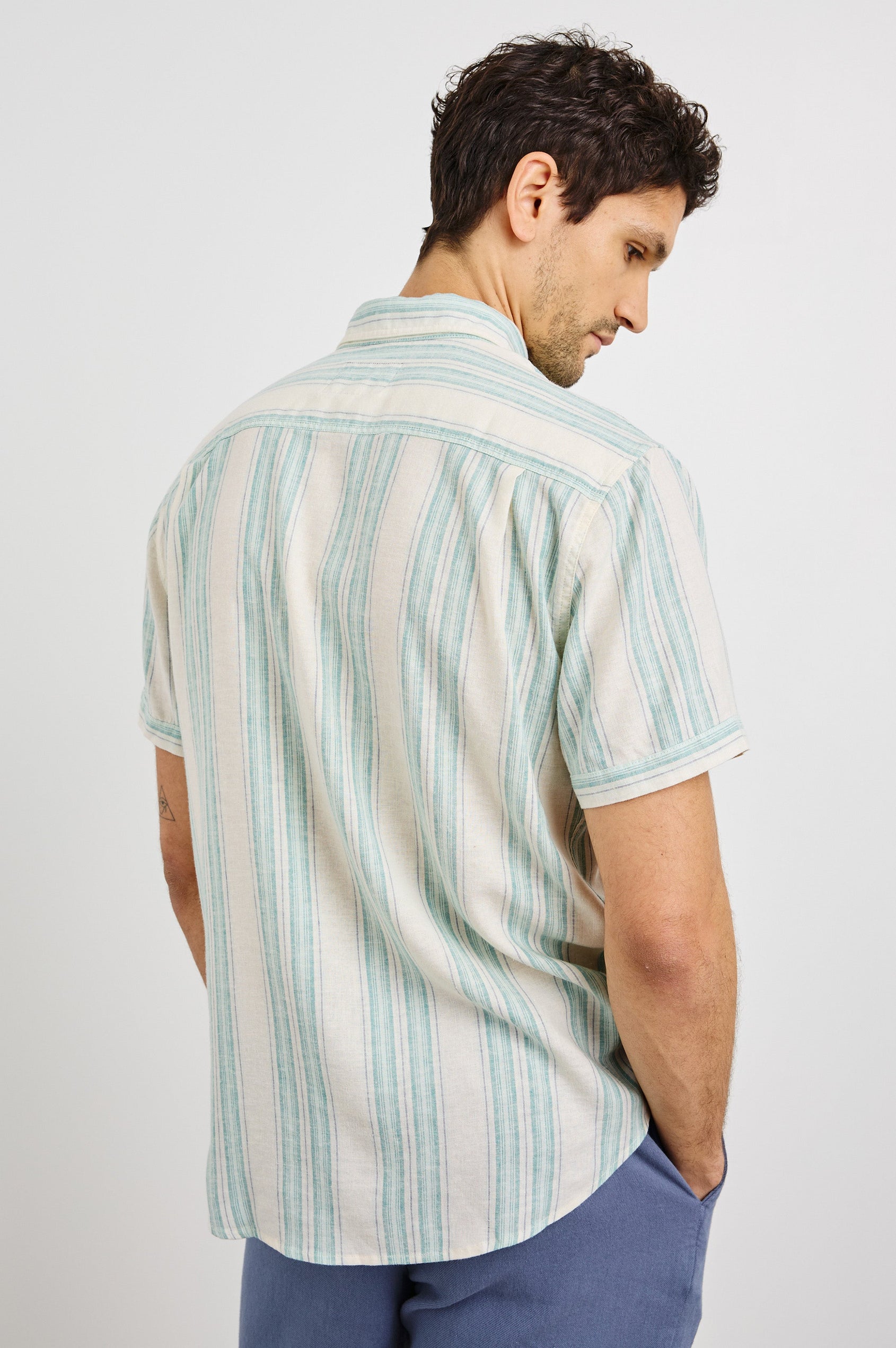 Carson Collared Button Front Shirt with Short Sleeves and a Chest Pocket in Riviera Stripe Colorway. Back View Shown on Model.