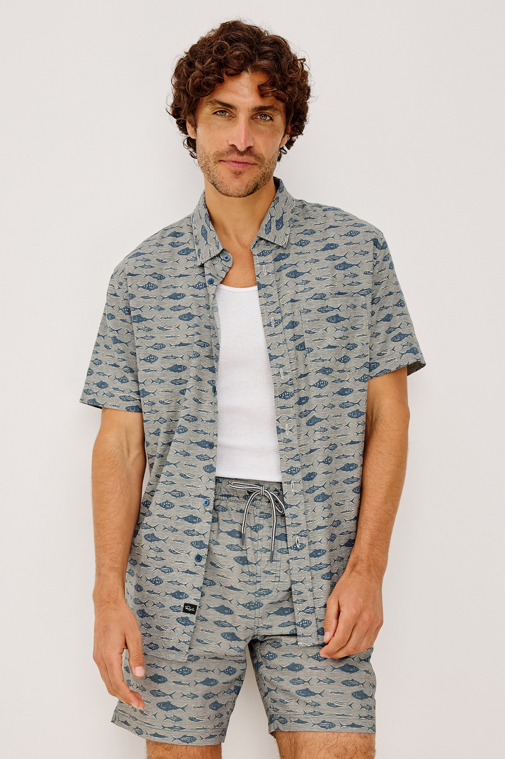 Carson Button-Up Shirt in Lighweight Seersucker With Collar, Chest Patch Pocket, Short Sleeves, and Classic Fit in Vintage Aquarium Etch Batik Colorway - Upper Body Front View Featured on Model
