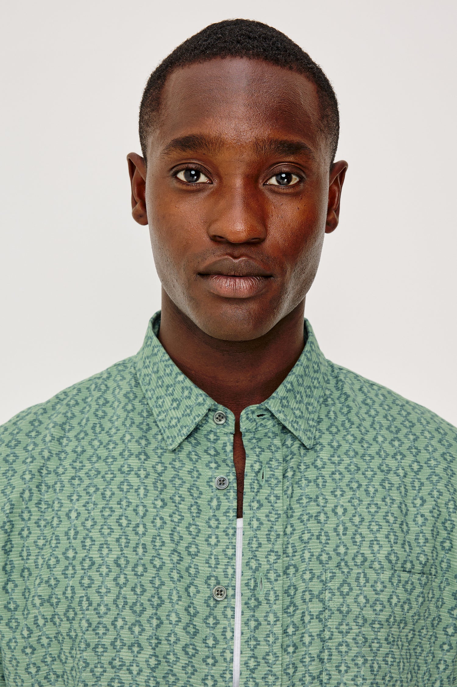 Carson Button Front Shirt in Linen Blend With Collar, Short Sleeves, Chest Patch Pocket, and Classic Fit in Batik Aqua Colorway - Model Portrait View