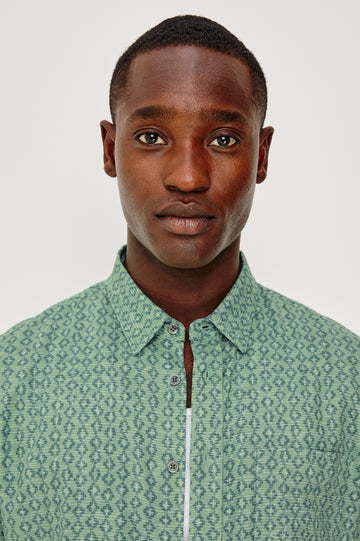 Carson Button Front Shirt in Linen Blend With Collar, Short Sleeves, Chest Patch Pocket, and Classic Fit in Batik Aqua Colorway - Model Portrait View