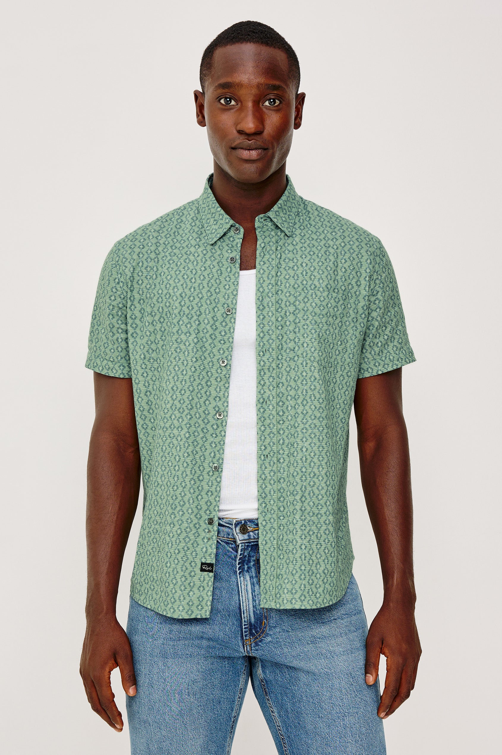 Carson Button Front Shirt in Linen Blend With Collar, Short Sleeves, Chest Patch Pocket, and Classic Fit in Batik Aqua Colorway - Upper Body Front View Featured on Model