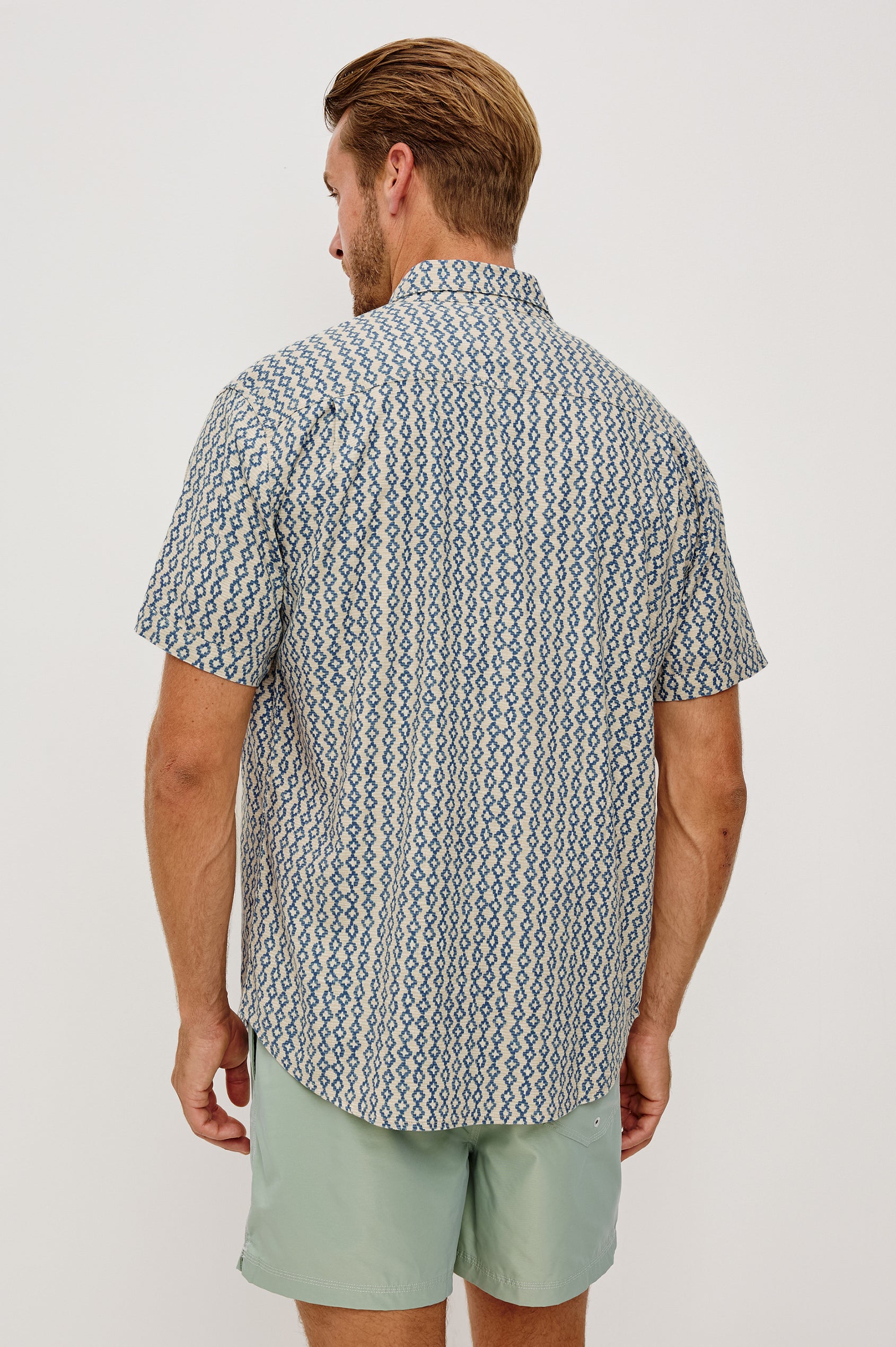 Carson Button-Up Short Sleeve Shirt in Linen Blend With Collar and Classic Fit in Wavy Batik Coast Colorway - Upper Body Back View Featured on Model
