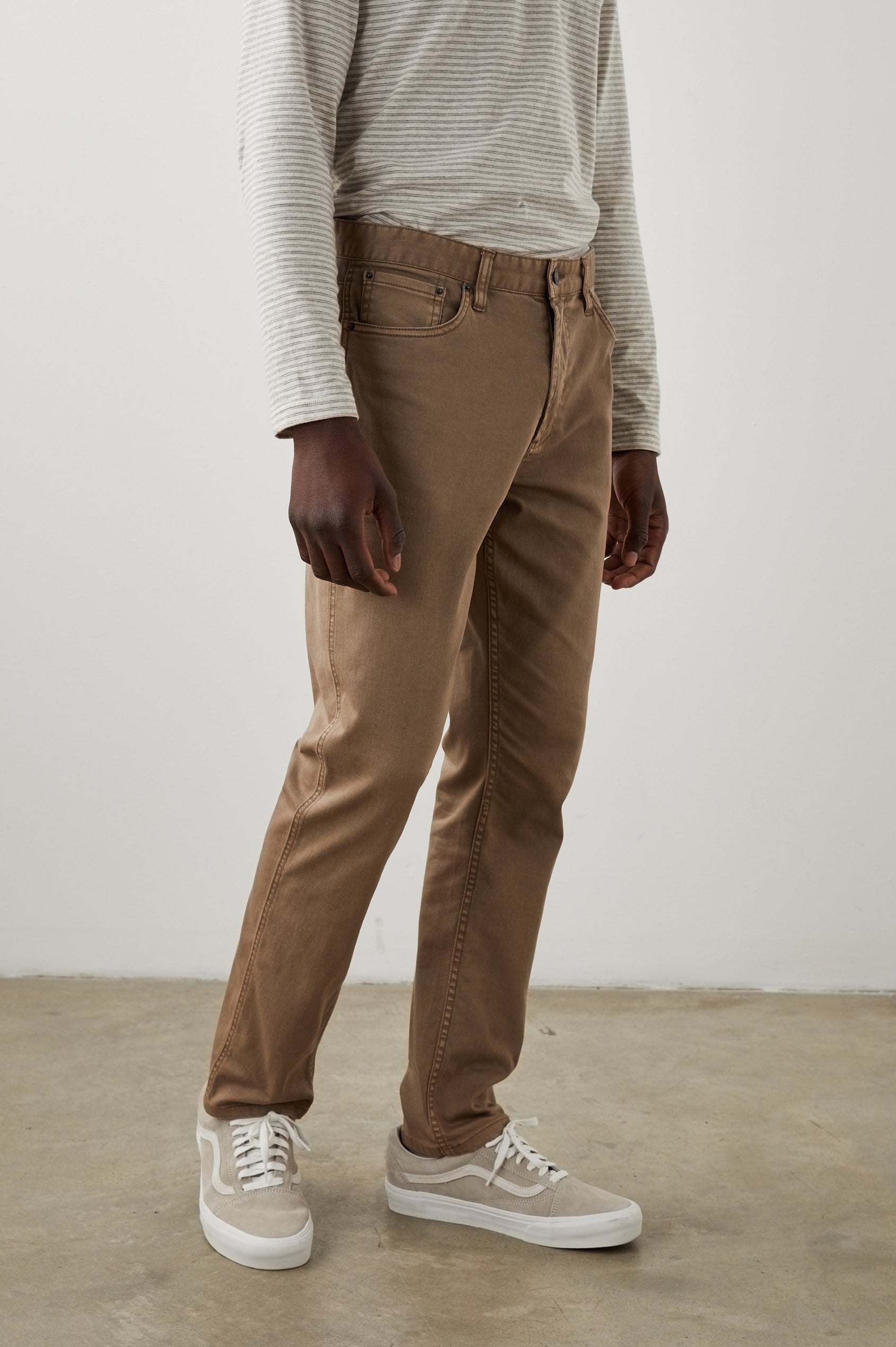 Carver Pants with Belt Loops, Two Front Pockets plus a Coin Pocket and Two Back Patch Pockets in Cacao Colorway - Side View Featured on Model
