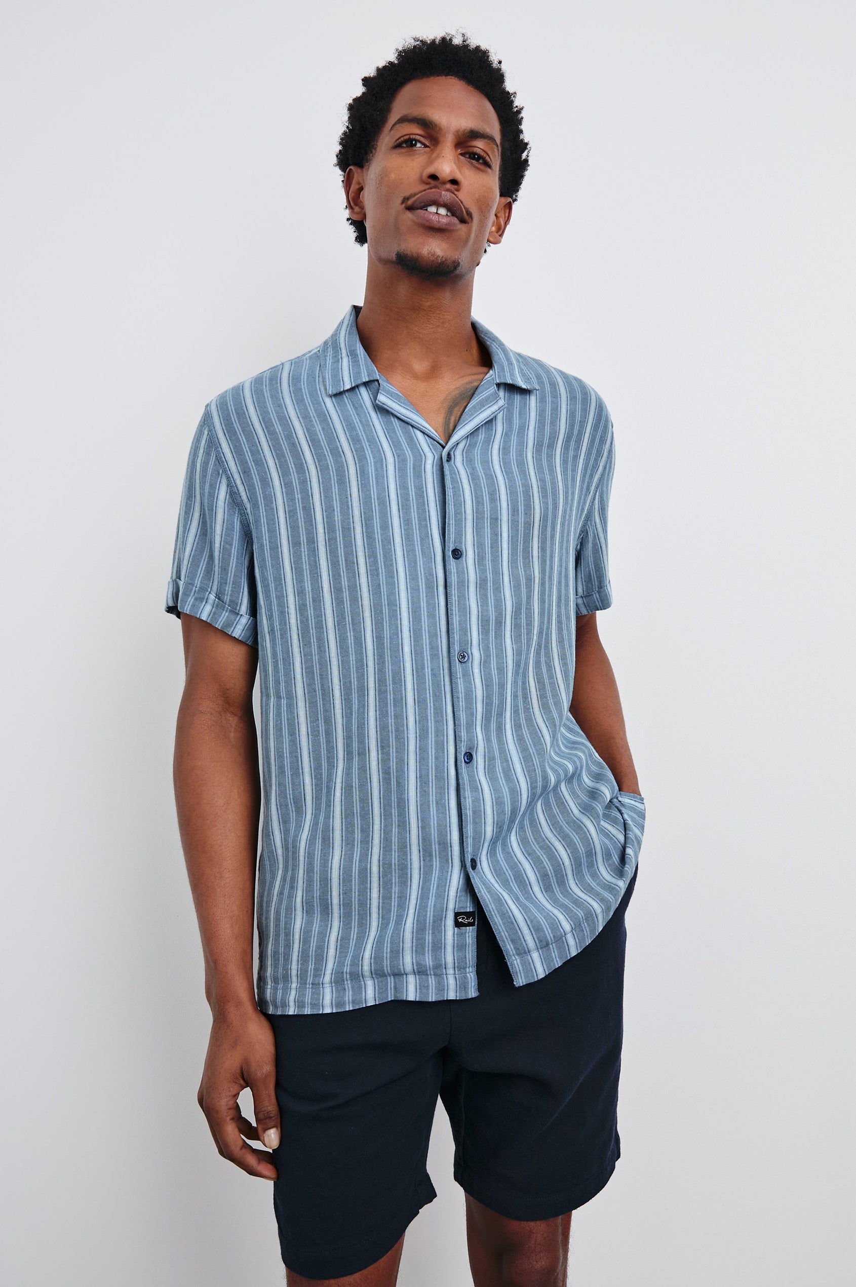 Cayman short sleeve shirt with contrast front buttons in Coastal Blue Stripe - front view on model