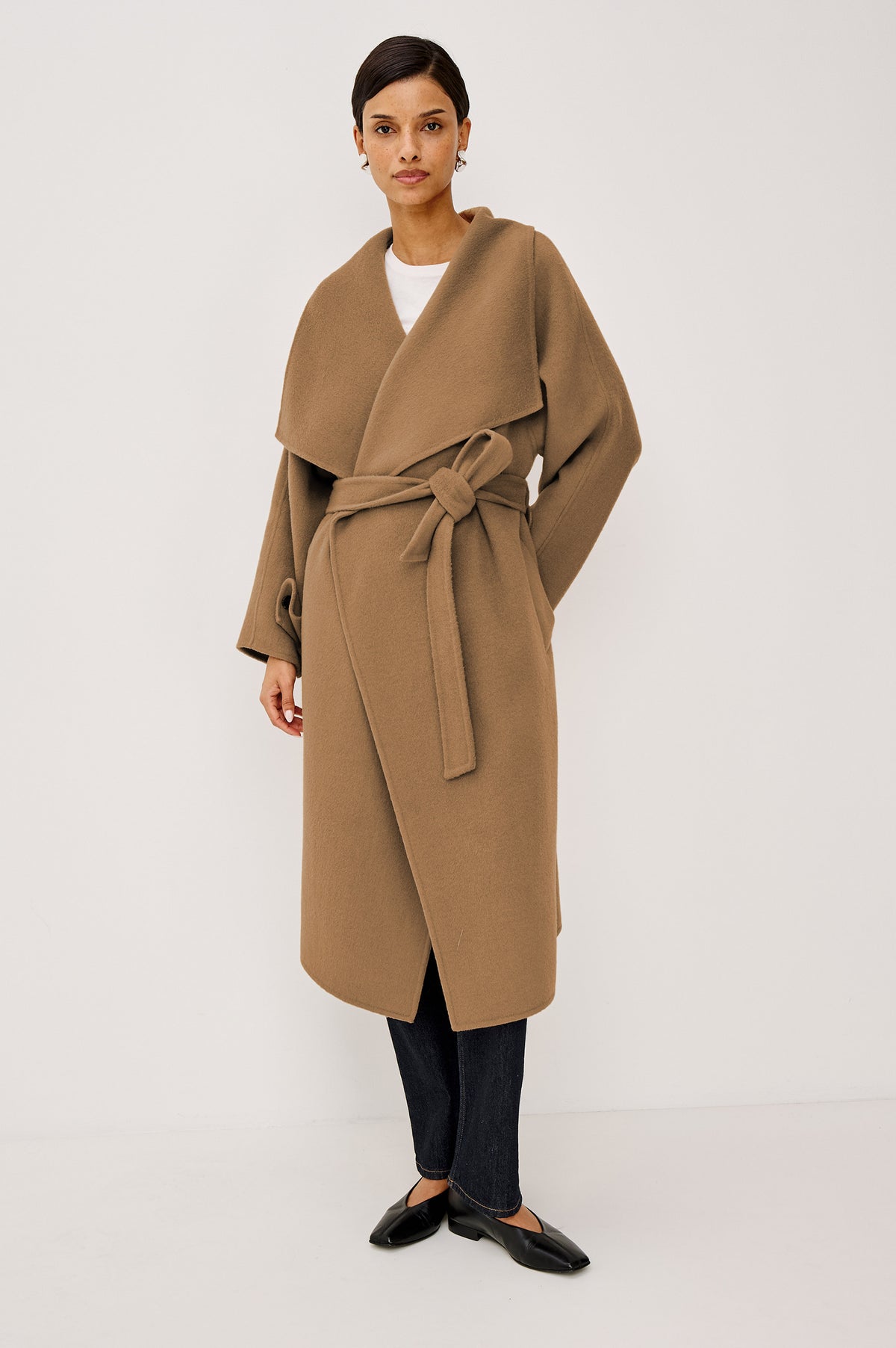 Celeste Coat in Heavy Wool Blend With Shawl Collar, Full Length, Self-Belted Waist, Side Pockets, Button-Tab Cuffs, and Half-Lined Interior in Camel Colorway - Full Body Front View Featured on Model