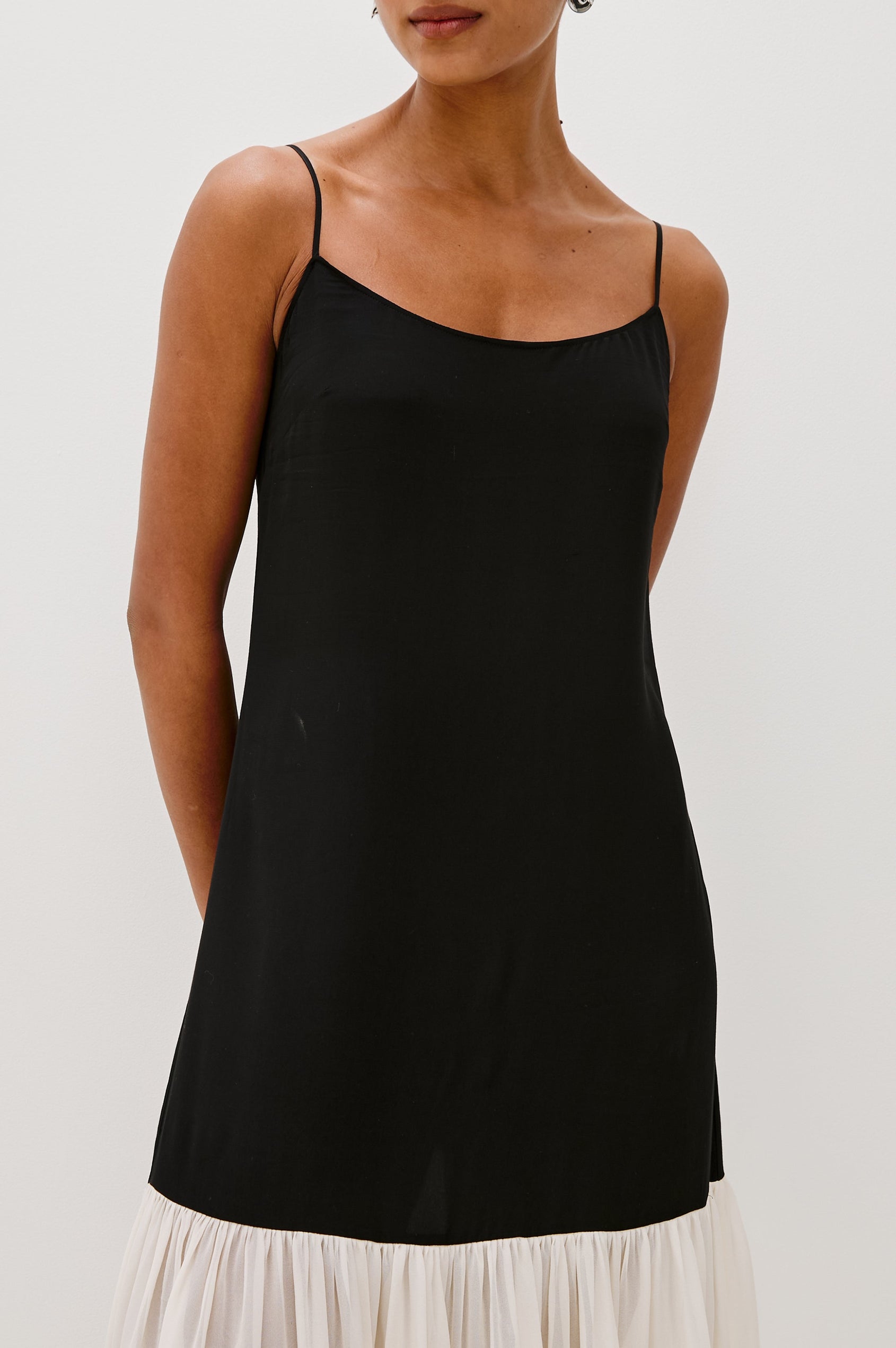 Chandra Maxi Tank Dress with Spaghetti Straps and a Contrast Semi Sheer Fabric Gathered Hem in Black Ivory Colorway - close up of top details on model