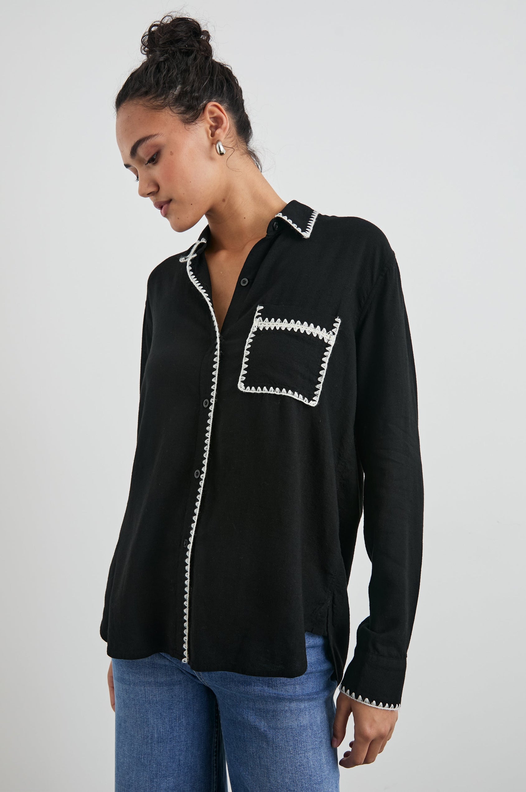 Charli Long-Sleeve Button up with a Chest Patch Pocket in Black Blanket Stitch Colorway, with white blanket stitches on black - Front View Featured on Model