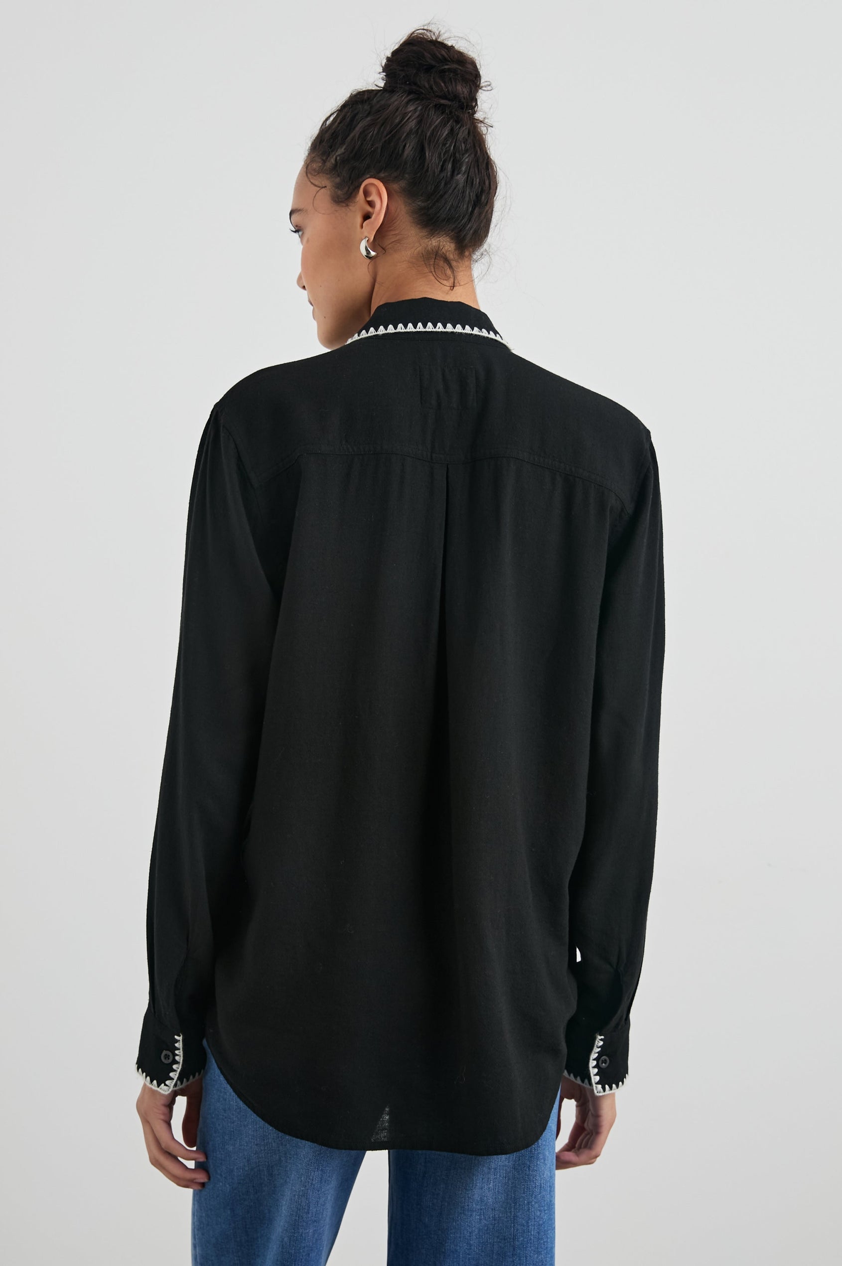 Charli Long-Sleeve Button up with a Chest Patch Pocket in Black Blanket Stitch Colorway, with white blanket stitches on black - Back View Featured on Model