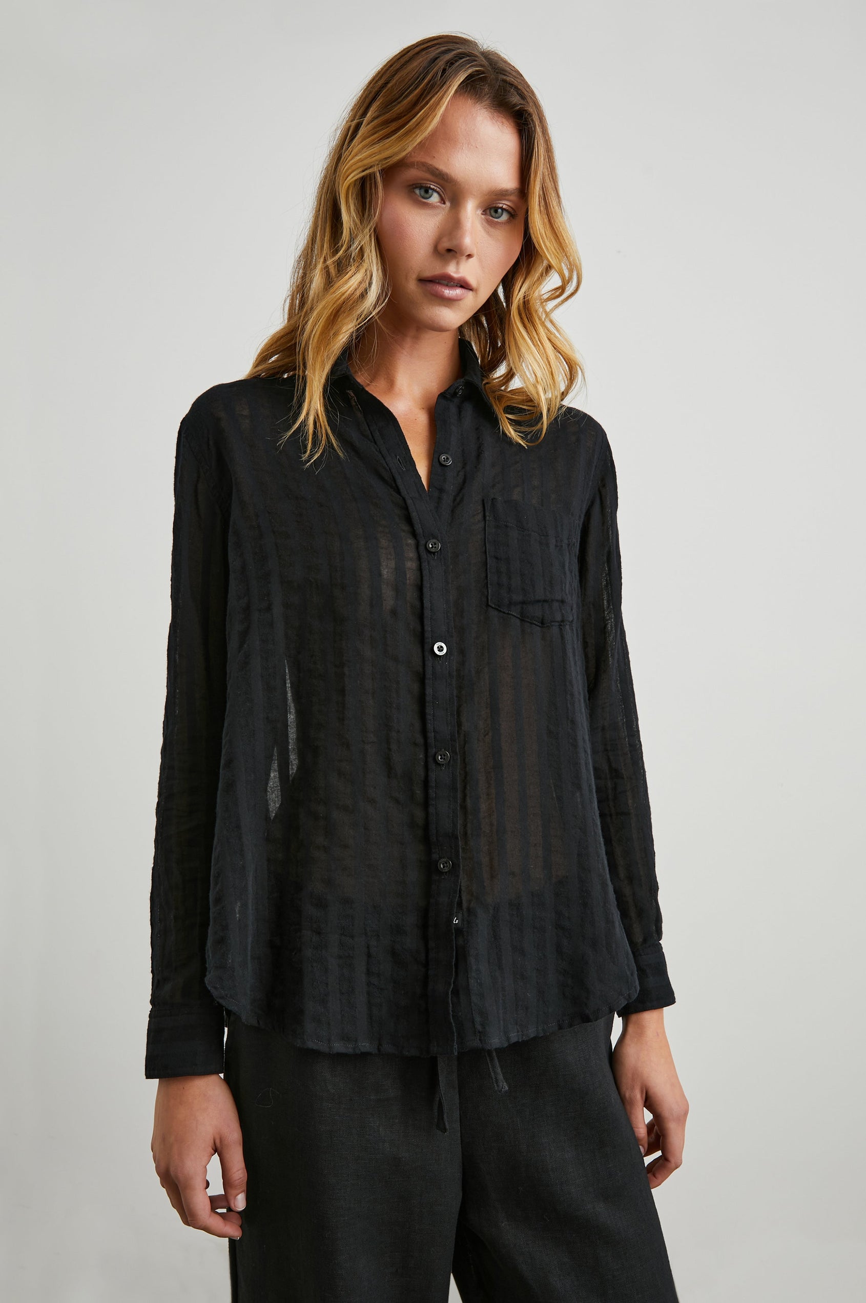 Charli Long-Sleeve Button up with a Chest Patch Pocket in Black Shadow Stripe Colorway, with Vertical Solid and Gauzy Black Stripes  - Front View Featured on Model