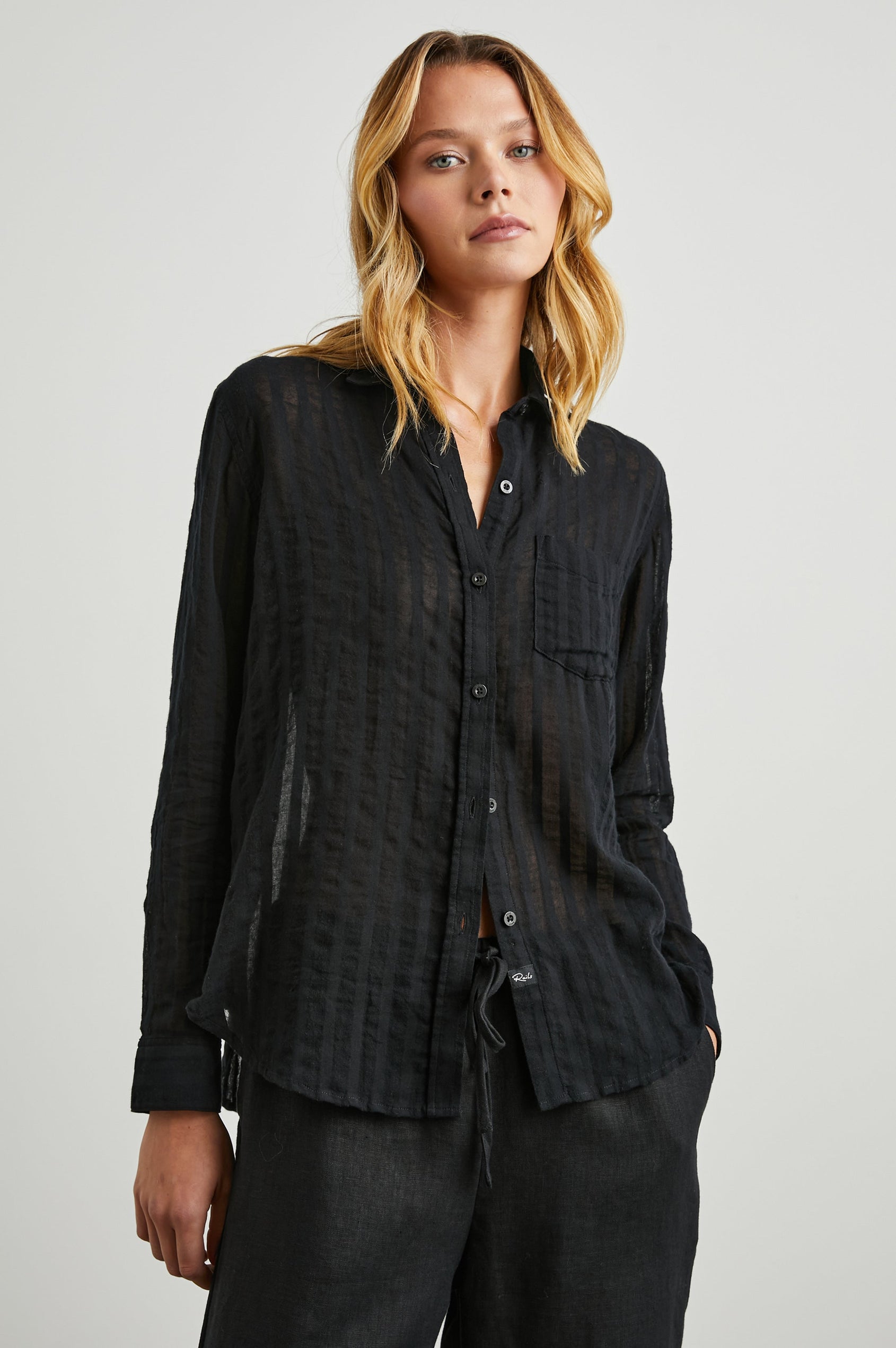 Charli Long-Sleeve Button up with a Chest Patch Pocket in Black Shadow Stripe Colorway, with Vertical Solid and Gauzy Black Stripes  - Front View Featured on Model