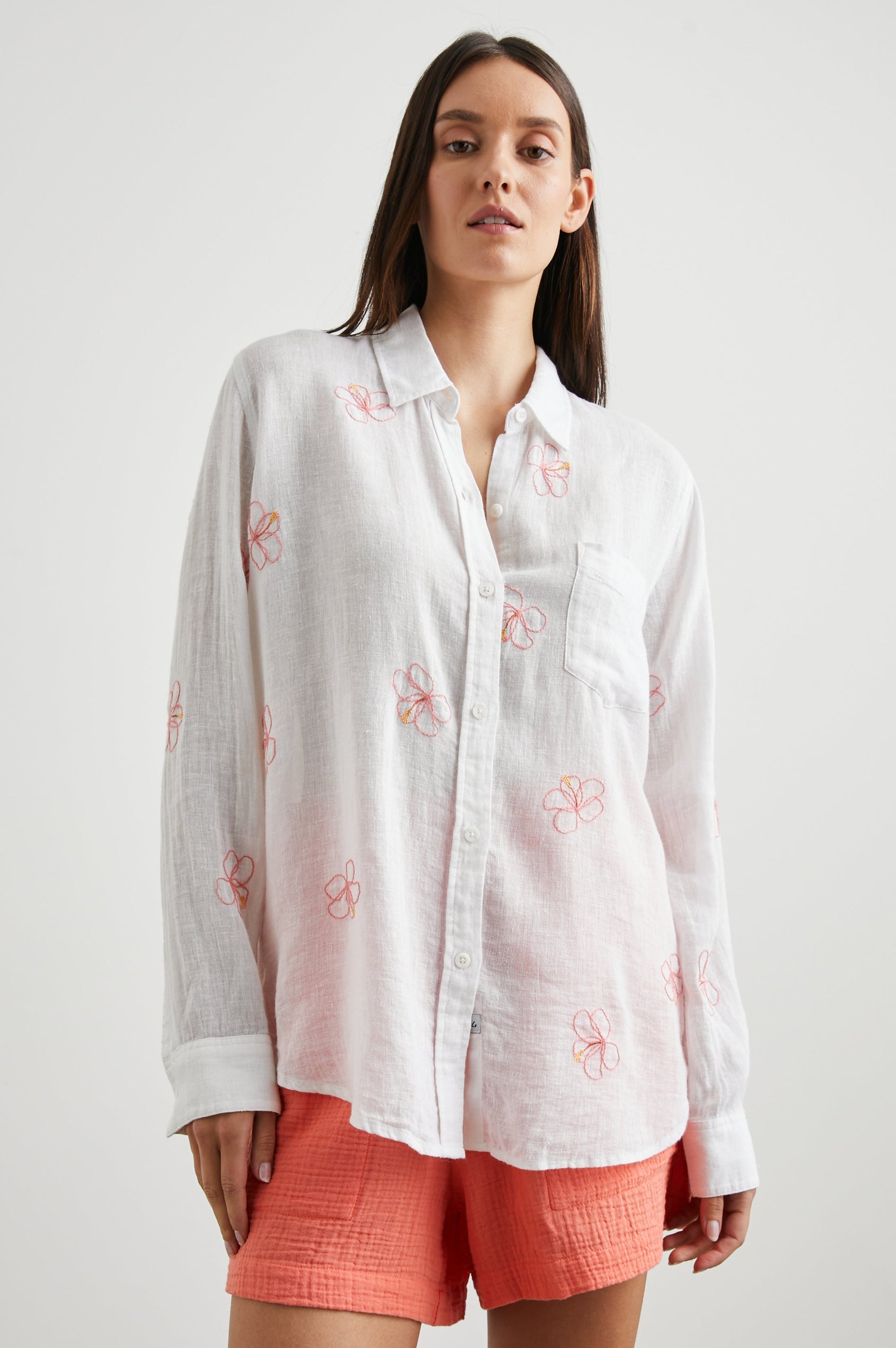 Charli Long-Sleeve Button up with a Chest Patch Pocket in Hibiscus Embroidery Colorway, with Hibiscus on white  - Front View Featured on Model