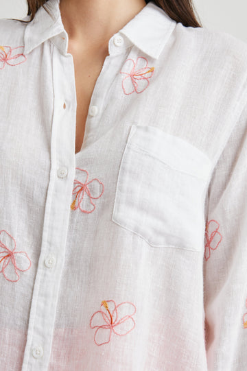 Charli Long-Sleeve Button up with a Chest Patch Pocket in Hibiscus Embroidery Colorway, with Hibiscus on white  - Front View Featured on Model