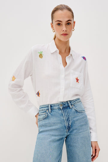 Charli Collared Button Front Shirt with Long Sleeves and a Front Chest Pocket and Scattered Embroidery All Over in Island Embroidery Colorway. Front View Shown on Model.