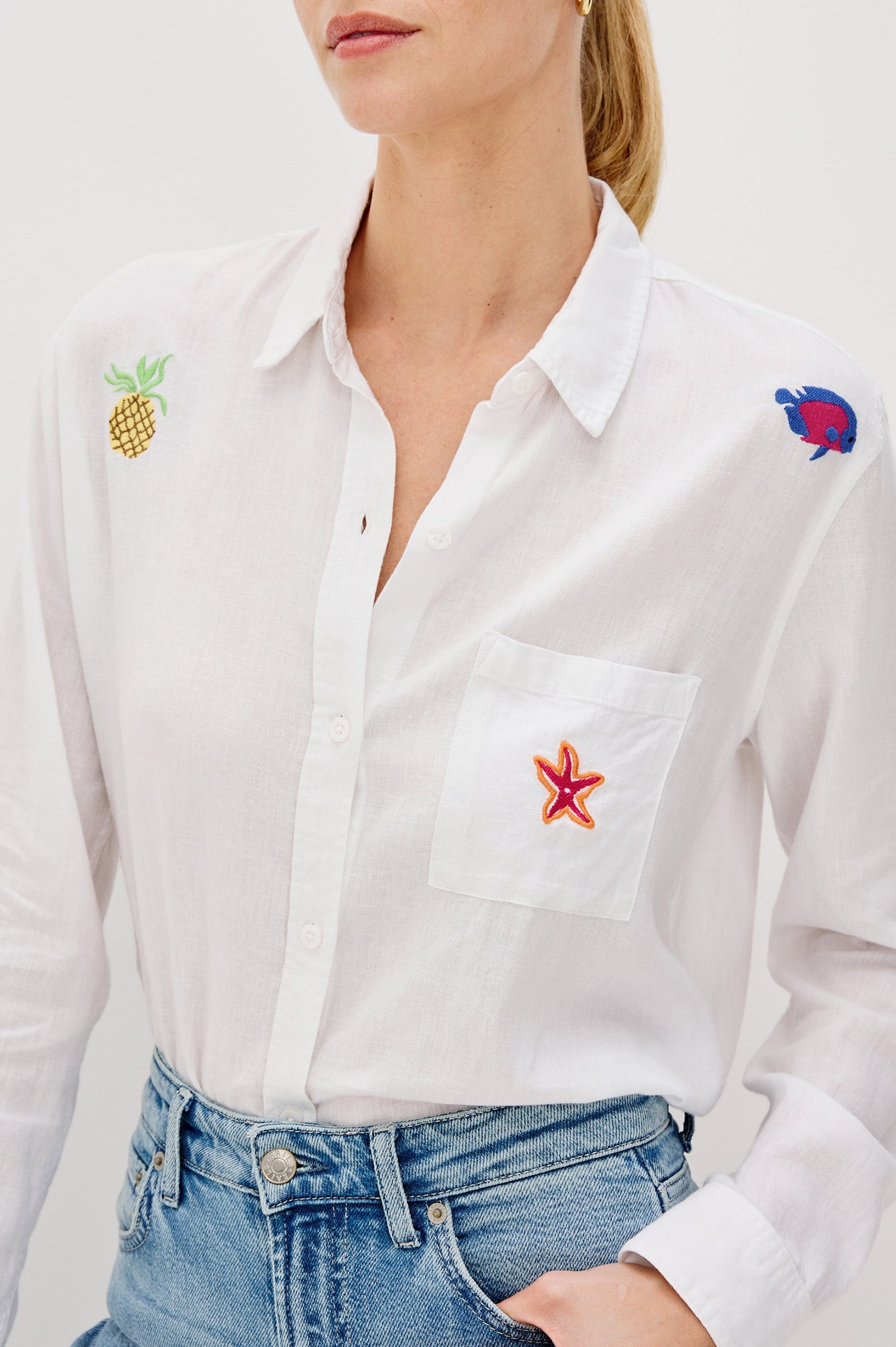 Charli Collared Button Front Shirt with Long Sleeves and a Front Chest Pocket and Scattered Embroidery All Over in Island Embroidery Colorway. Front Detail View Shown on Model.