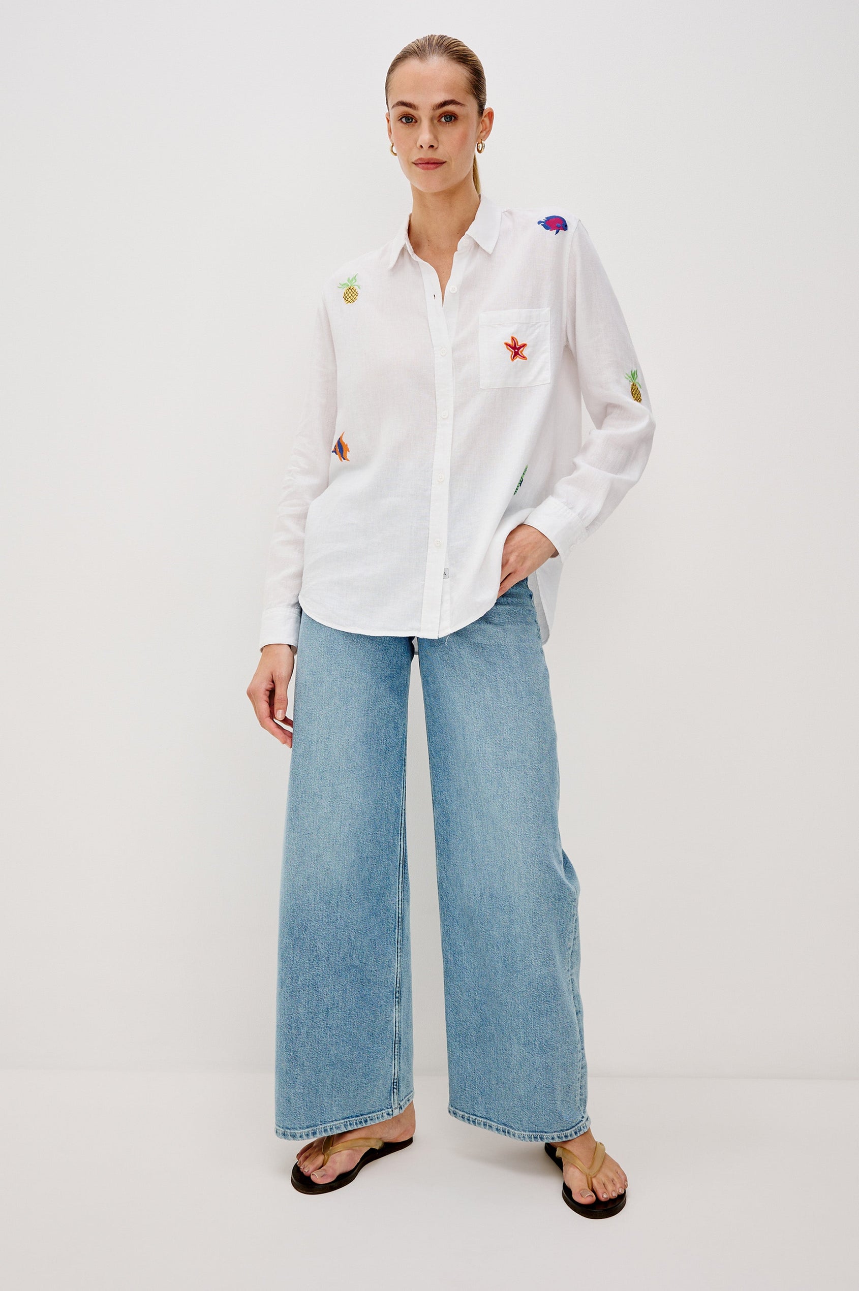 Charli Collared Button Front Shirt with Long Sleeves and a Front Chest Pocket and Scattered Embroidery All Over in Island Embroidery Colorway. Full Body Front View Shown on Model.