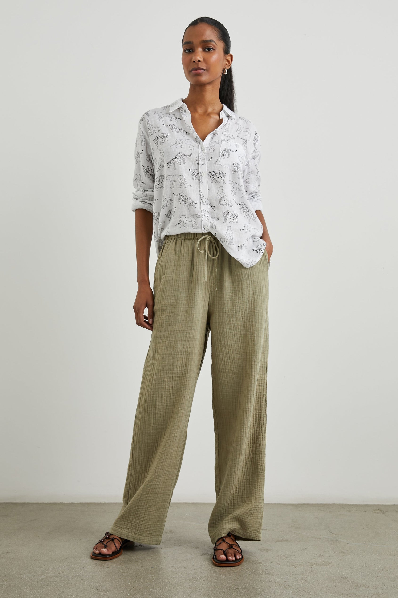 Charli Long-Sleeve Button up with a Chest Patch Pocket in Ivory Jungle Cats Colorway, with black jungle cats on ivory  - Front Full Body View Featured on Model