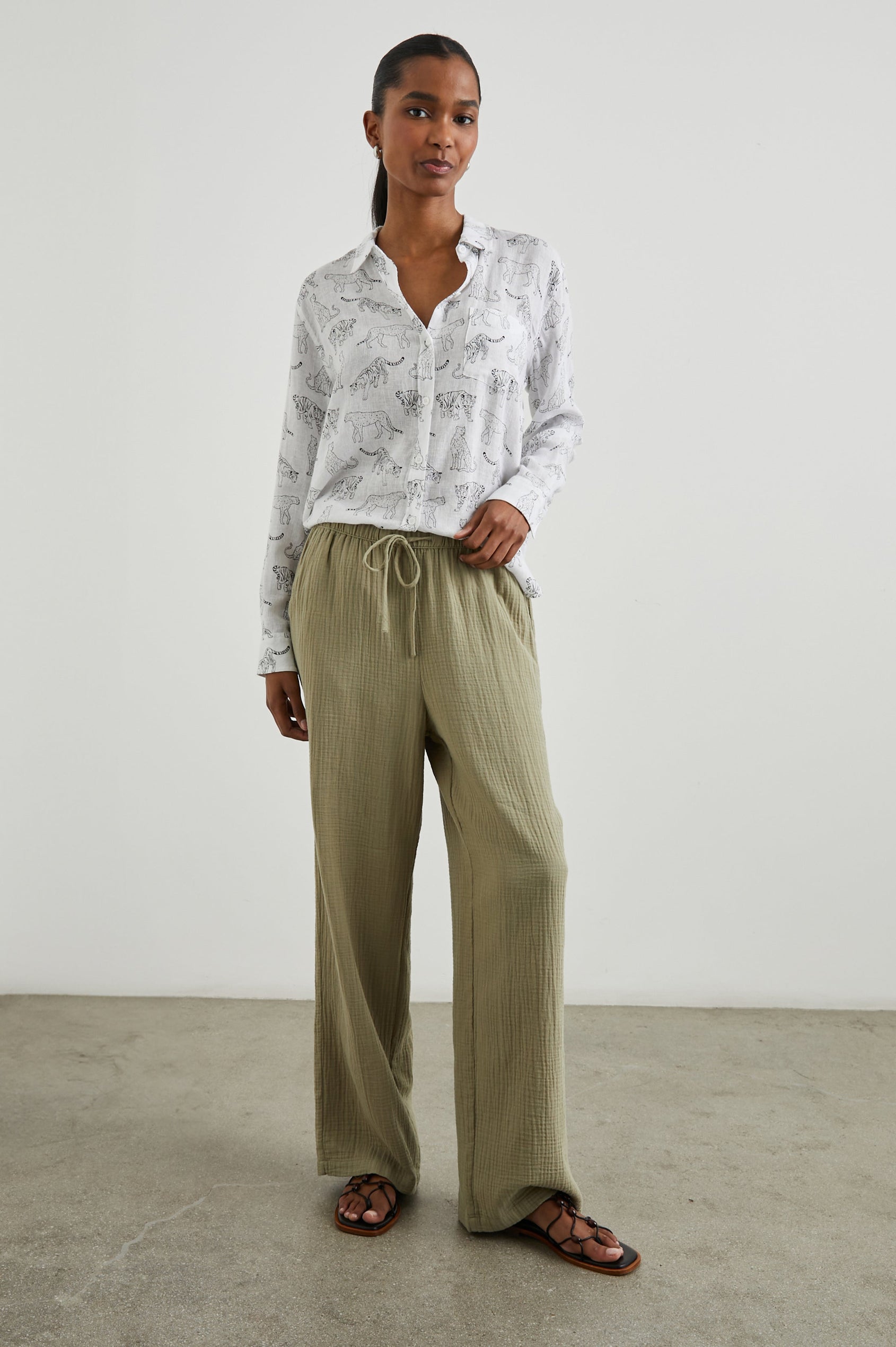 Charli Long-Sleeve Button up with a Chest Patch Pocket in Ivory Jungle Cats Colorway, with black jungle cats on ivory  - Front Tucked Full Body View Featured on Model