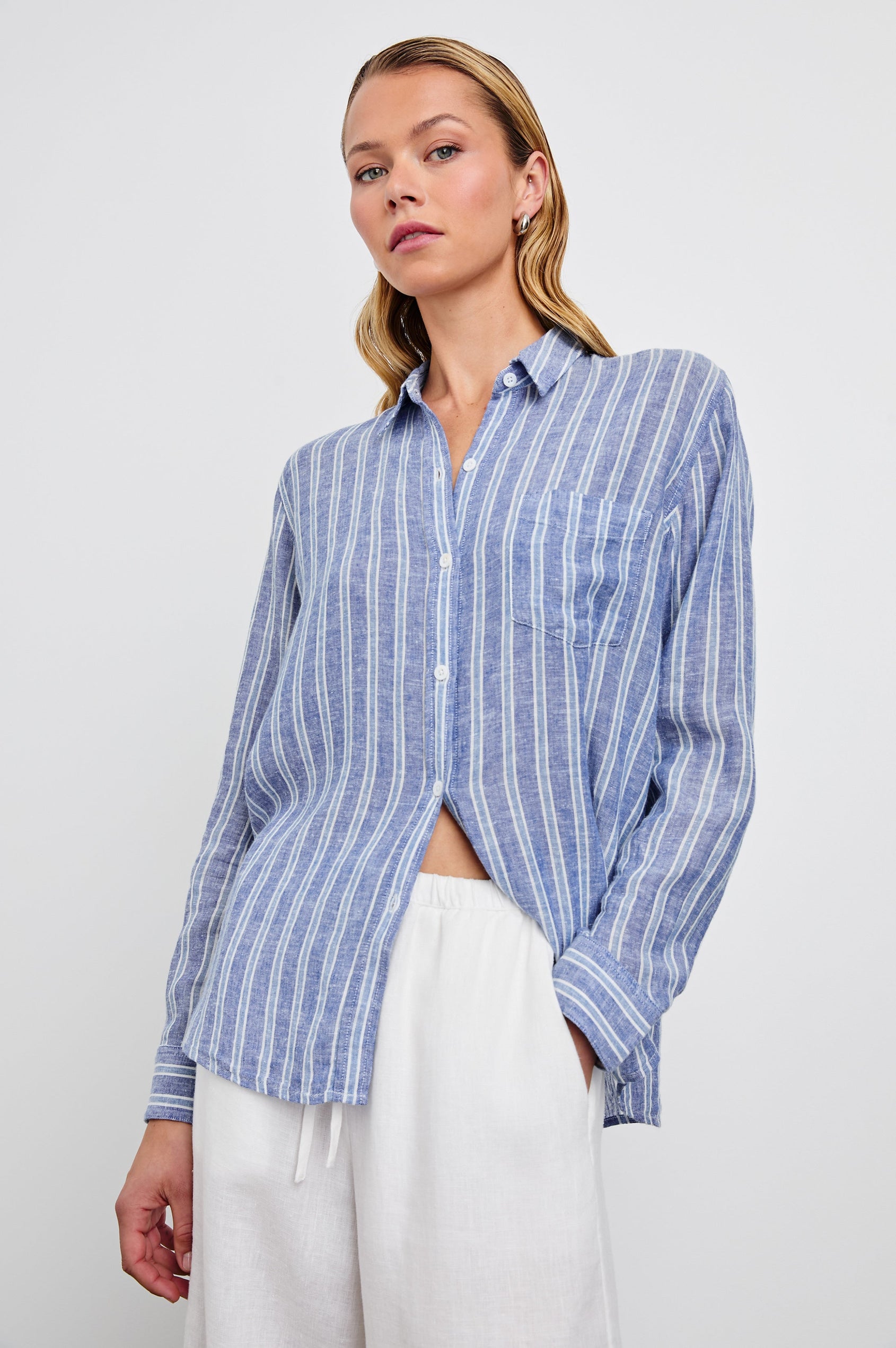 Charli Long-Sleeve Button up with a Chest Patch Pocket in Lake View Stripe Colorway, with alternating light blue and blue stripes, each bordered by white stripes - Front View Featured on Model
