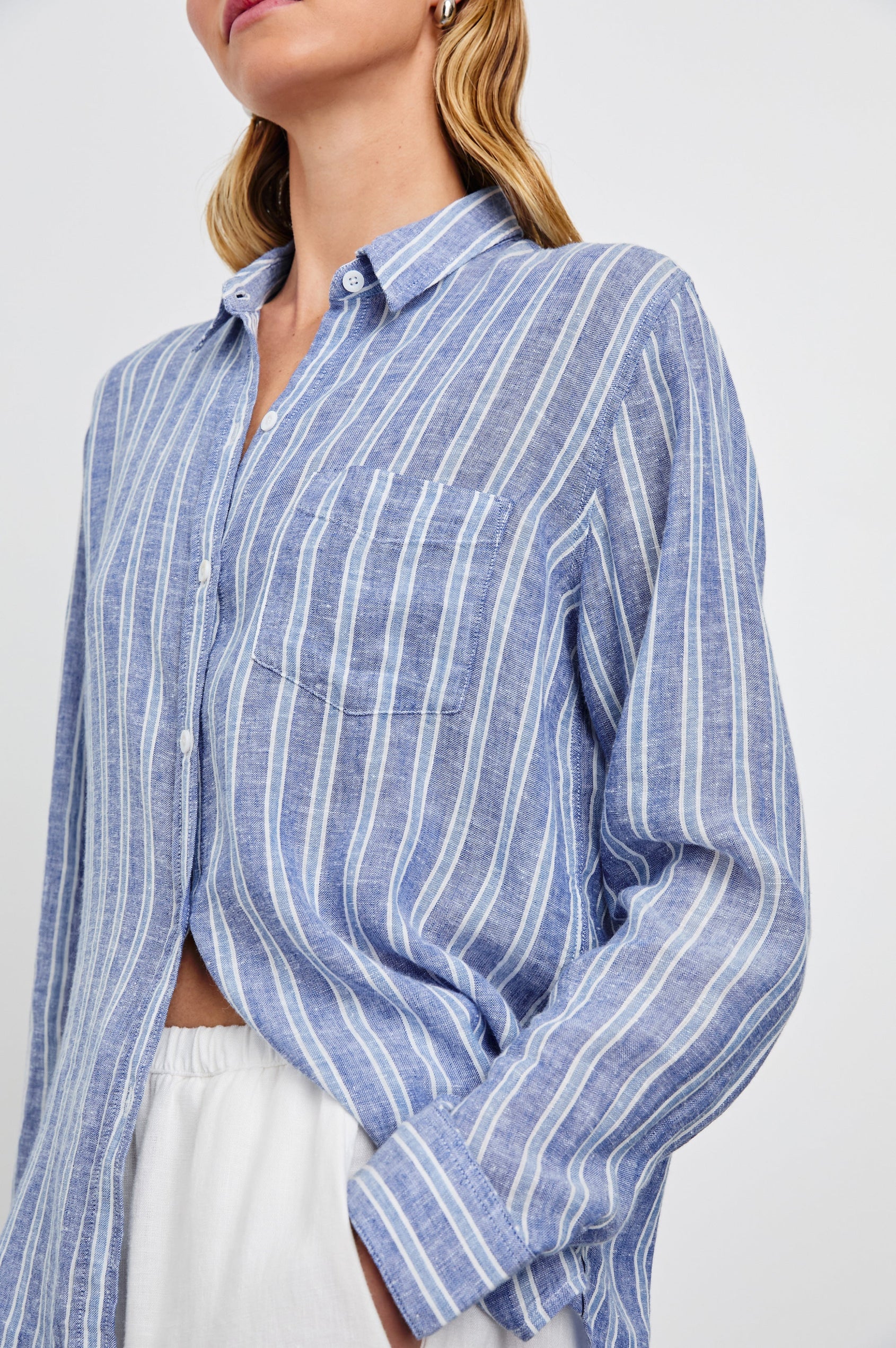 Charli Long-Sleeve Button up with a Chest Patch Pocket in Lake View Stripe Colorway, with alternating light blue and blue stripes, each bordered by white stripes - Front View Featured on Model