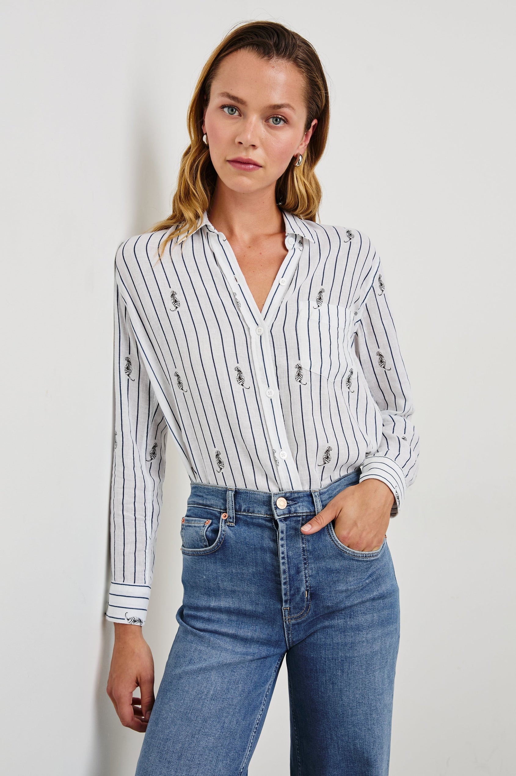 Charli Long-Sleeve Button up with a Chest Patch Pocket in Navy Striped Tigers Colorway, with vertical navy stripes dashed with black tigers on ivory - Front Tucked View Featured on Model