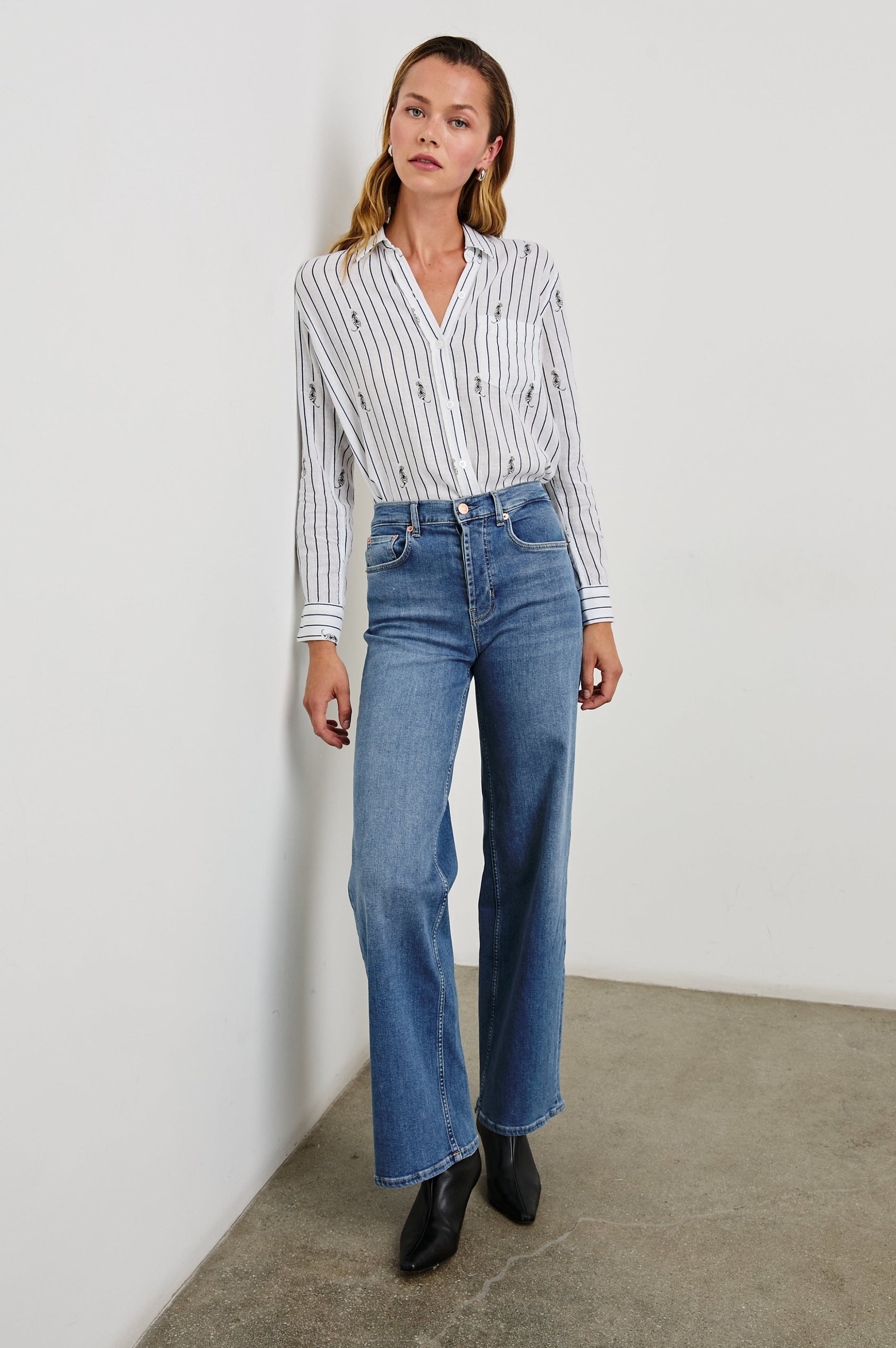 Charli Long-Sleeve Button up with a Chest Patch Pocket in Navy Striped Tigers Colorway, with vertical navy stripes dashed with black tigers on ivory - Front Tucked Full Body View Featured on Model