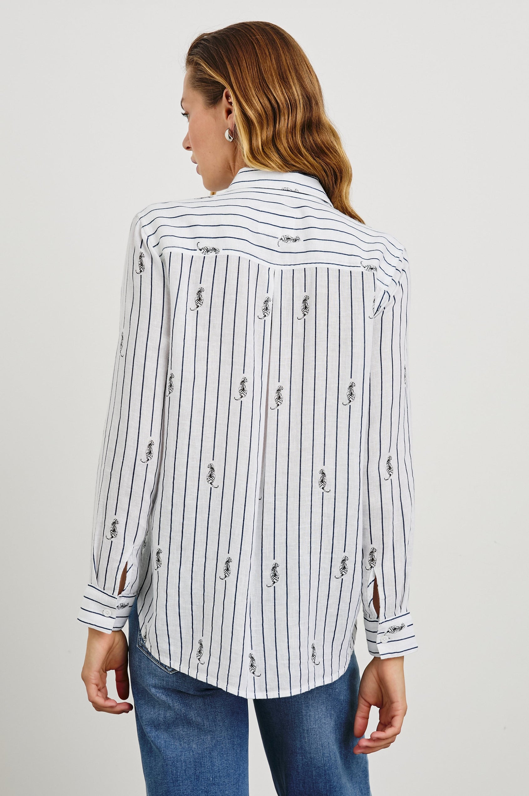 Charli Long-Sleeve Button up with a Chest Patch Pocket in Navy Striped Tigers Colorway, with vertical navy stripes dashed with black tigers on ivory - Back View Featured on Model