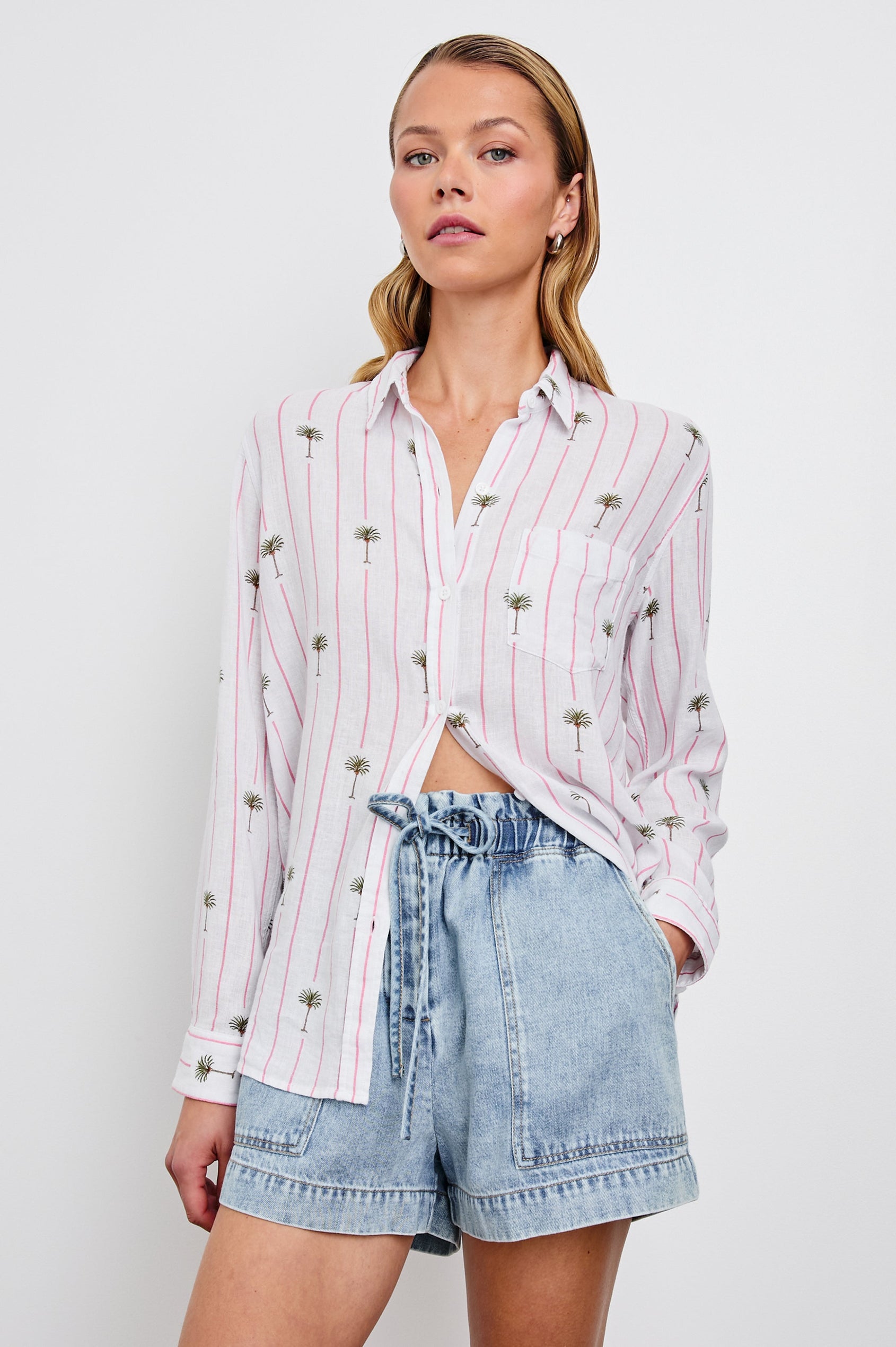 Charli Long-Sleeve Button up with a Chest Patch Pocket in Pink Palm Colorway, with pink vertical stripes dashed with palm trees on ivory  - Front View Featured on Model