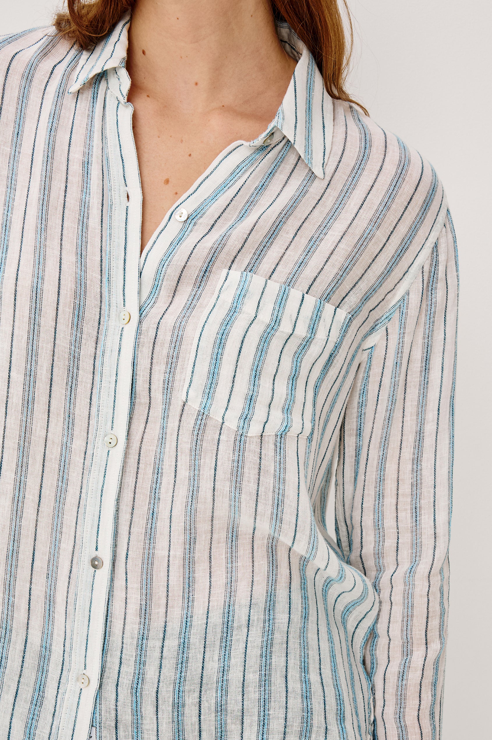 Charli Button-Up Shirt in Eco-Friendly Linen Blend With Collar Long Sleeves Single Chest Patch Pocket in Ivory Bengal Colorway - Upper Body Close Up View Featured on Model