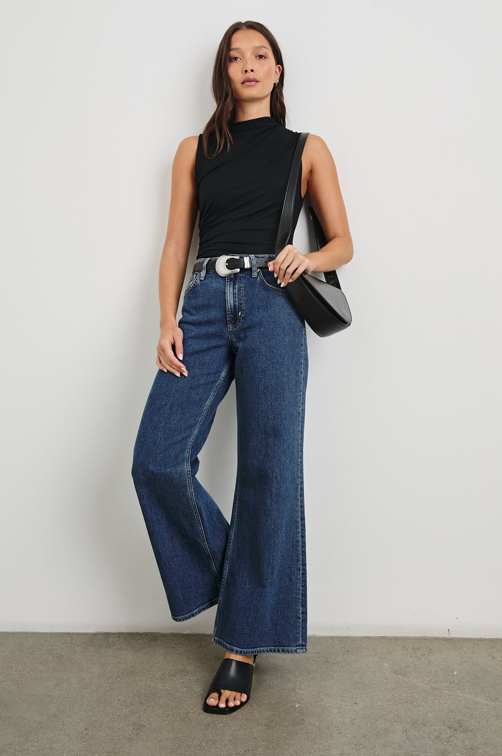 Christen Sleeveless Top with a Mock Neck and Ruching Along One Side Seam in Black Colorway - Front Full Body View Featured on Model