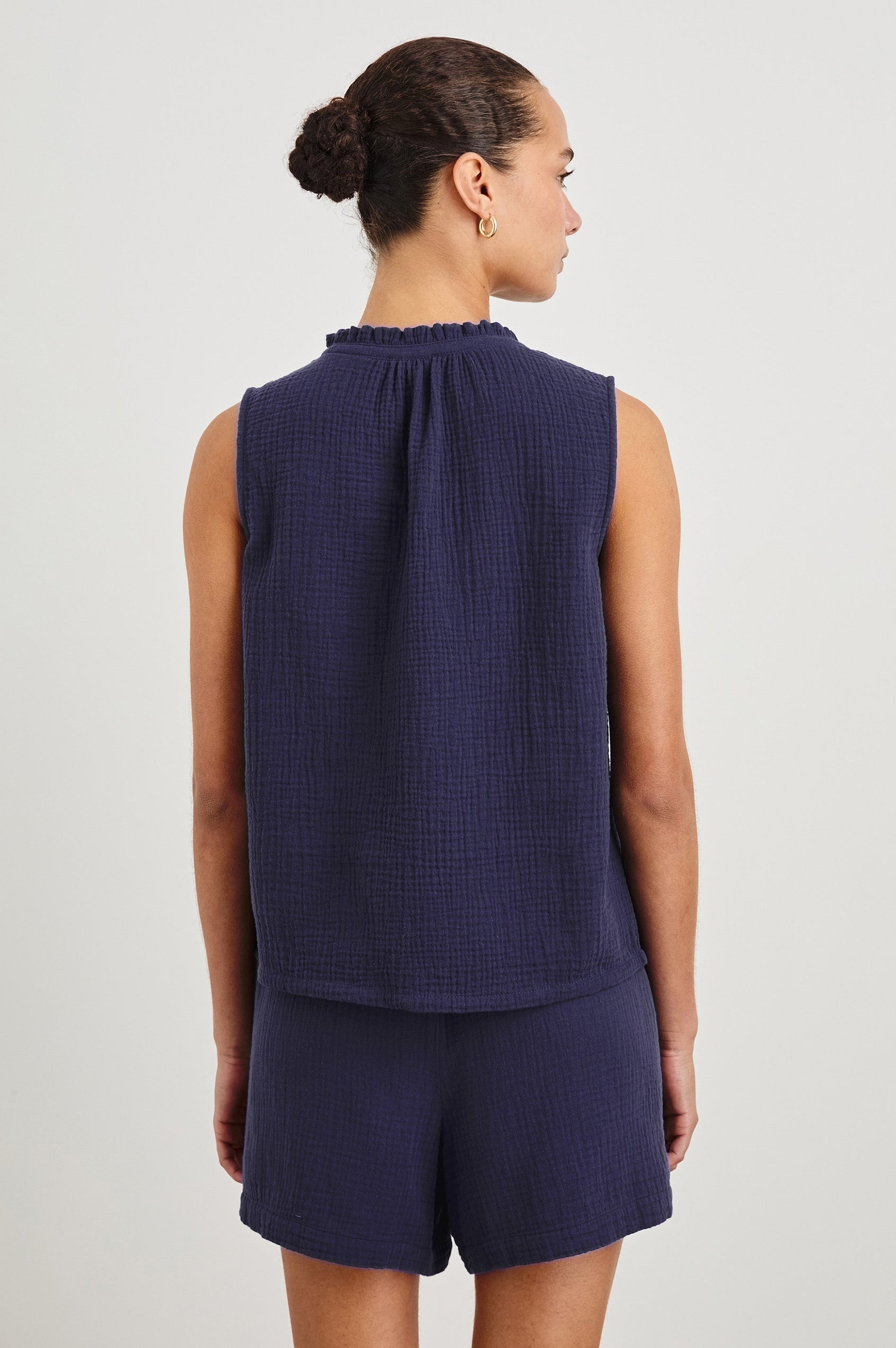 Christy Cotton Gauze Sleeveless Top with Collared V-Neck In Colorway Admiral Blue - back view featured on model