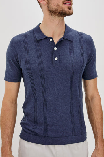 Cillian short sleeve cotton silk blend polo with three button placket and retro  front stripe details in Indigo Denim - front detail view on model 
