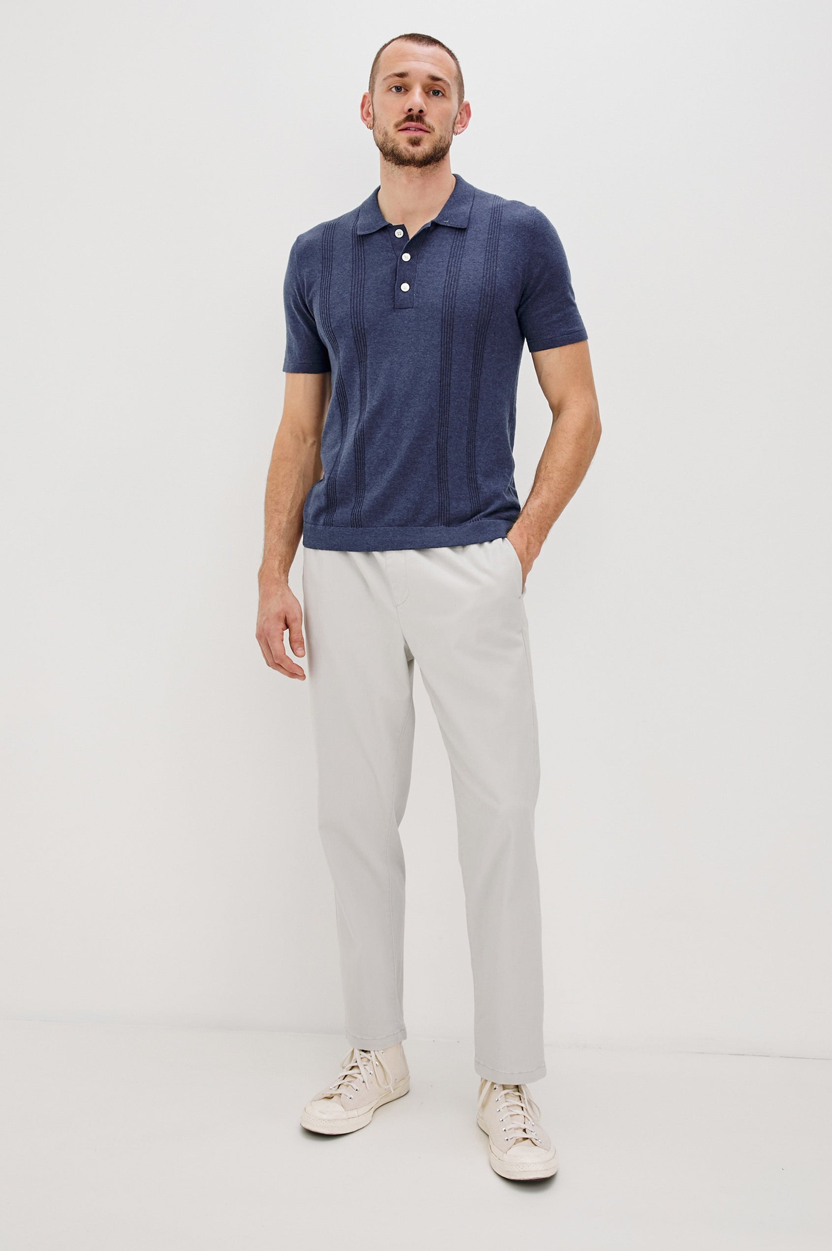 Cillian short sleeve cotton silk blend polo with three button placket and retro  front stripe details in Indigo Denim - full body front view on model 
