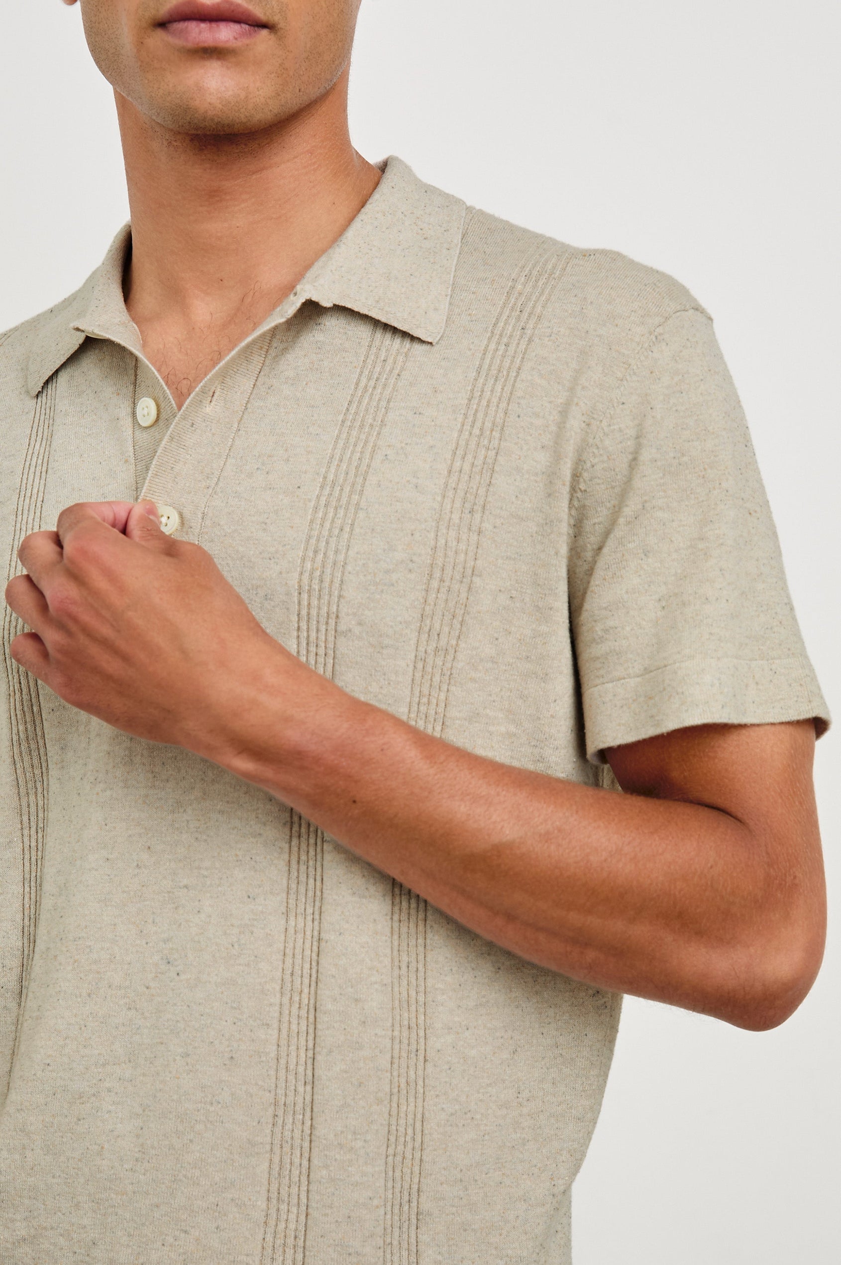 Cillian short sleeve cotton silk blend polo with three button placket and retro  front stripe details in Silversand - close up of details on model