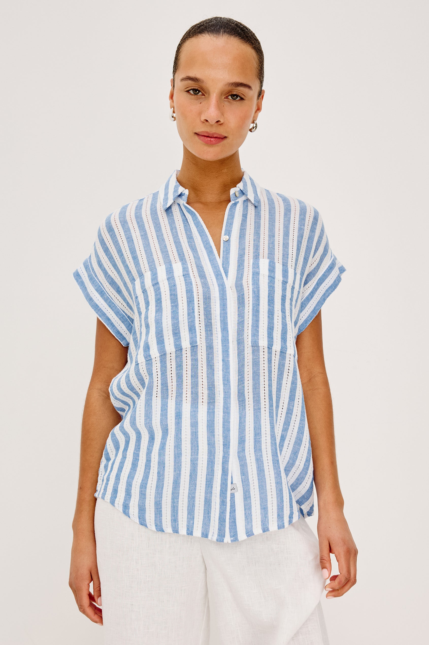 Cito Relaxed Button-Up Shirt in Luxe Linen With Collar, Chest Patch Pockets, and Cuffed Cap Sleeves in Atlantis Stripe Colorway - Upper Body Front View Featured on Model